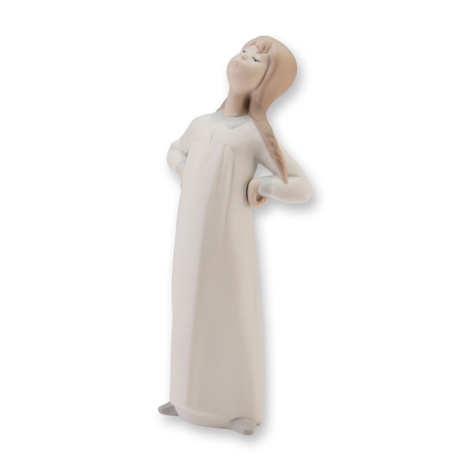 Lladro Porcelain Figurine, Girl Stretching 1004872: Depicts a young girl in a long nightgown with her hands placed on her hips in a stretching pose. The figurine is finished in a soft matte glaze with a muted color palette. The base features the blue L