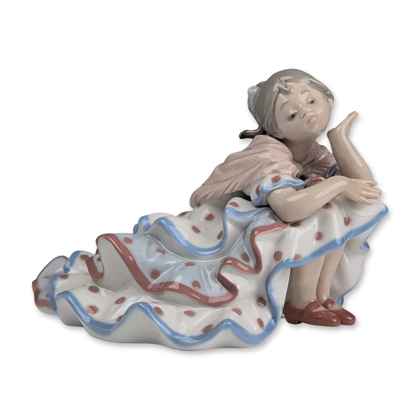 Lladro Spanish Glazed Porcelain Figurine, Deep in Thought 01005389: Lladro Spanish glazed porcelain figurine, model number 5389, titled Deep in Thought. The figure depicts a seated young girl with a thoughtful expression, resting her chin on one hand. She is dressed i