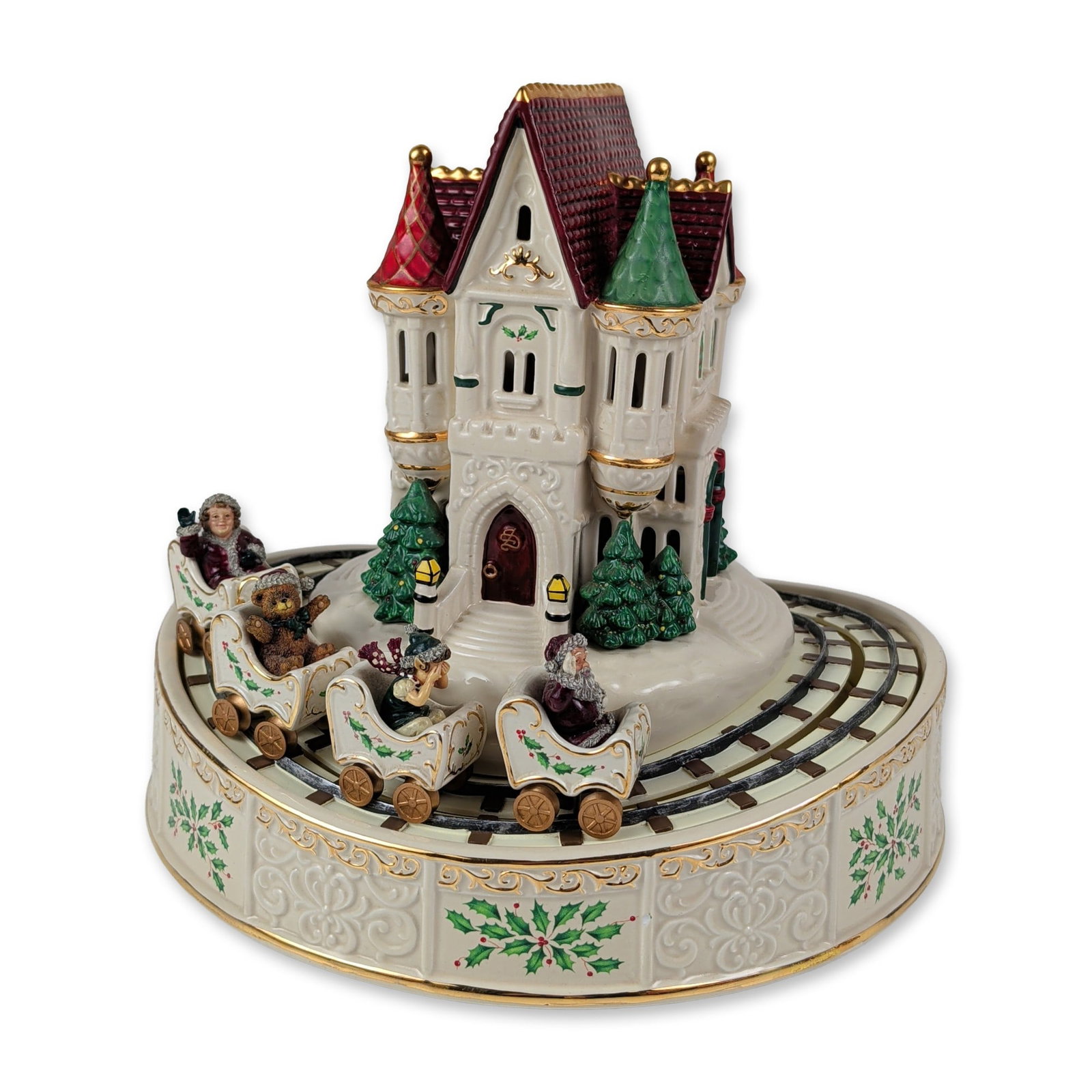 Lenox Porcelain Holiday Musical Roller Coaster: This holiday-themed musical sculpture by Lenox is crafted in fine ivory-color porcelain and decorated with hand-painted polychrome details and 24-karat gold trim. The circular base features embossed s