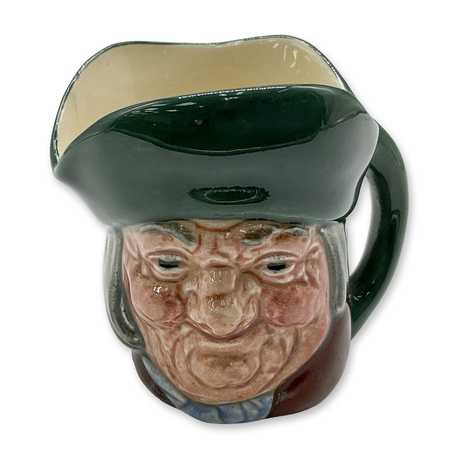 Toby Philpots D6043 - Mini - Royal Doulton Character Jug: Green hat; brown coat; blue scarf with white spots. Royal Doulton backstamp. Artist: Charles J. Noke Dimensions: 2.25"H Date or Era: 1939 - 1951 Manufacturer or Brand: Royal Doulton Country of Ori