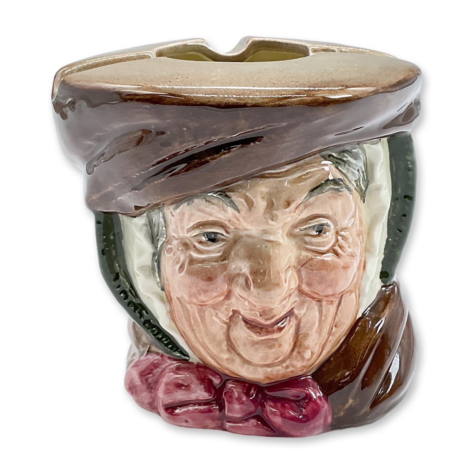 Sairey Gamp D6009 - Royal Doulton Ash Bowl: Brown band; burgundy bow. Royal Doulton backstamp. Artist: Leslie Harradine and Harry Fenton Dimensions: 3"H Date or Era: 1939 - 1960 Manufacturer or Brand: Royal Doulton Country of Origin: E