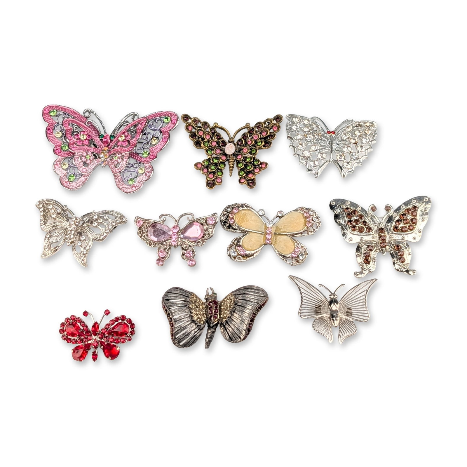10pc Collection of Rhinestone and Enamel Butterfly Brooches: A collection of ten butterfly and moth themed costume jewelry brooches in mixed base metals featuring silver-tone, gold-tone, antiqued bronze, and gunmetal finishes. The assortment includes a variety 