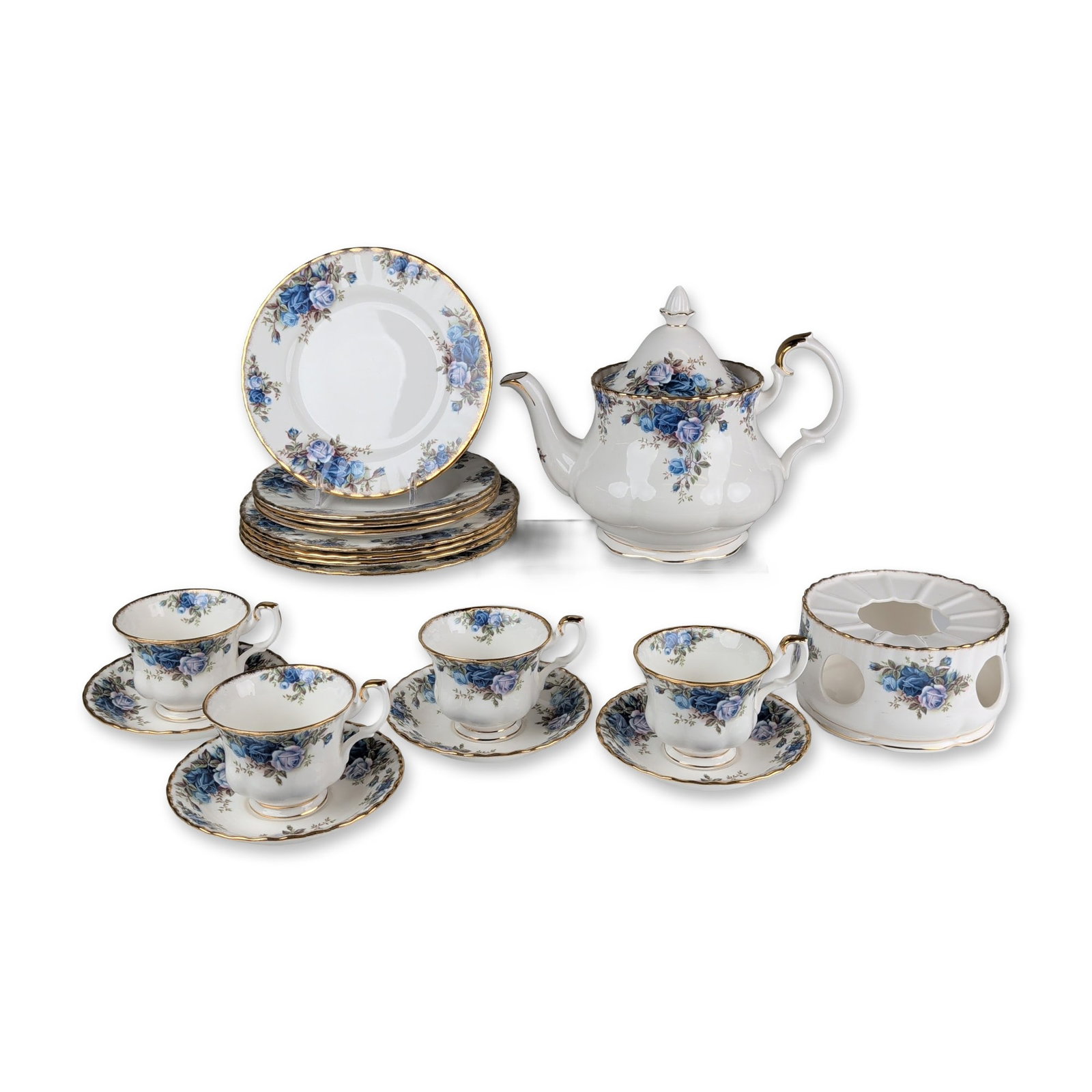 18pc Royal Albert Moonlight Rose Bone China Tea Service: English Royal Albert Moonlight Rose tea service in fine bone china, featuring transfer-printed blue and lavender rose floral sprays on fluted Montrose forms with scalloped gold-gilded rims. The base o