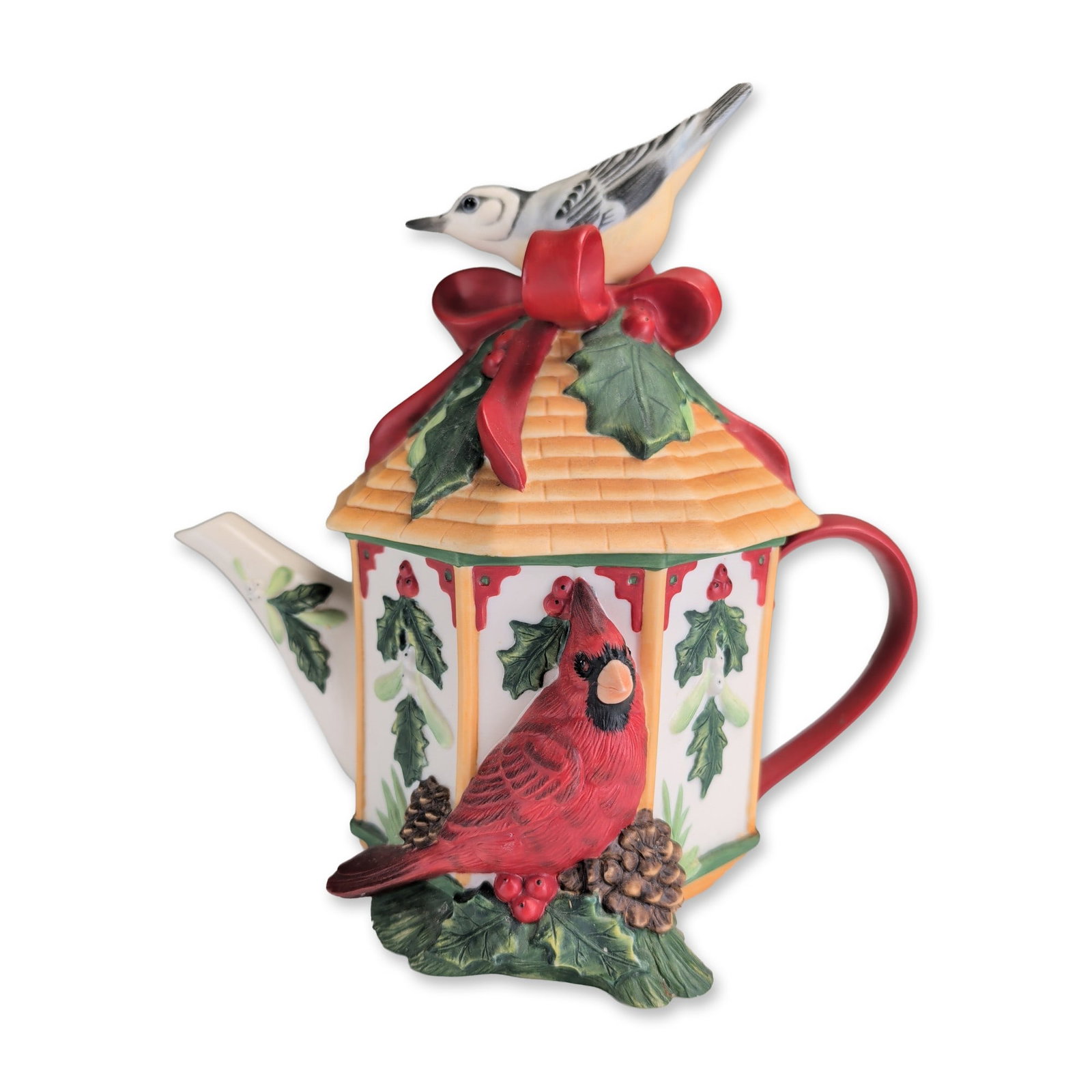 Lenox Winter Greetings Ceramic Birdhouse Lidded Teapot: Lenox ceramic figural birdhouse teapot from the Winter Greetings Everyday collection, designed by artist Catherine McClung. The octagonal vessel features a yellow shingled roof lid with a black-capped