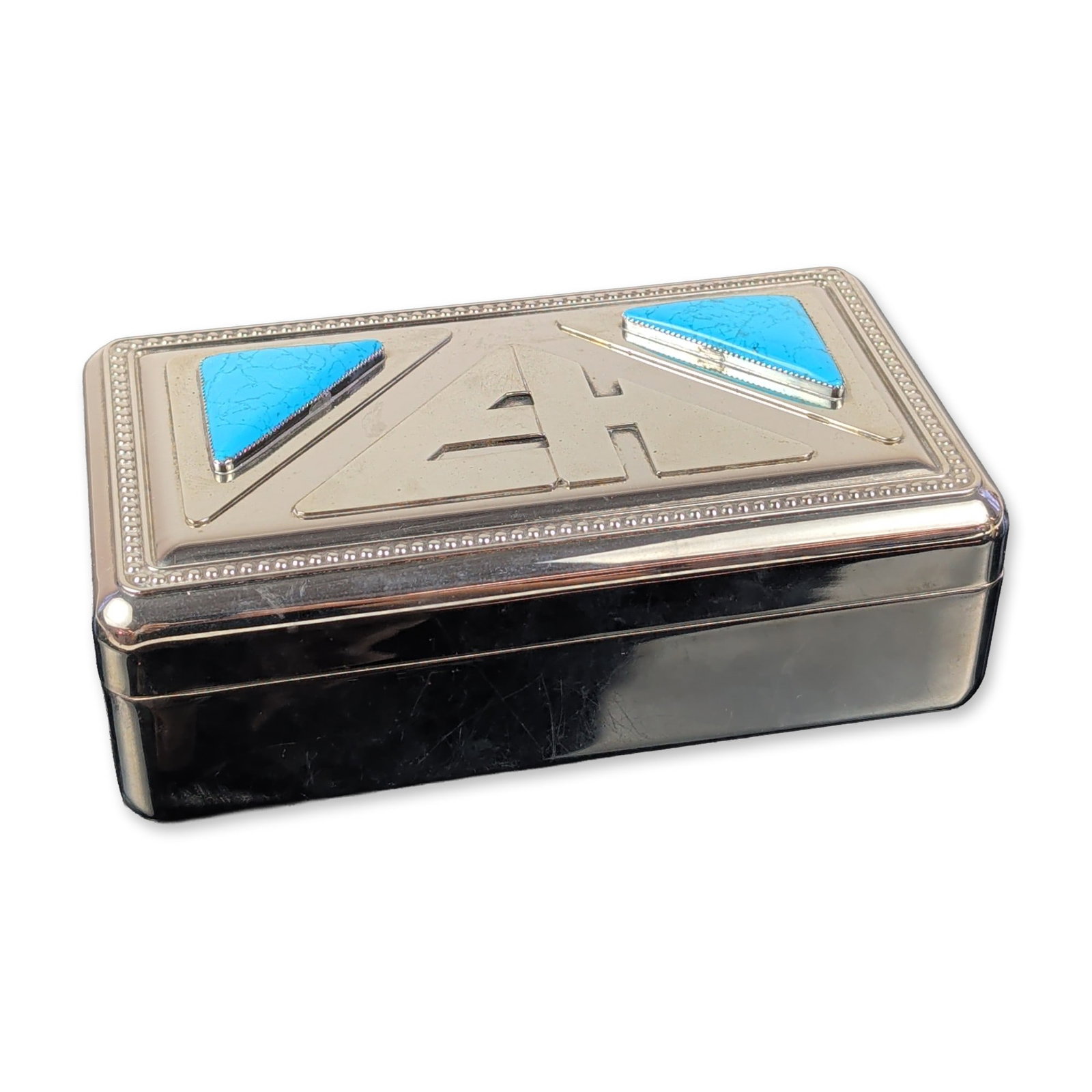 Art Deco Chrome and Turquoise Inlay Jewelry Box: Art Deco style jewelry box in polished silver-toned metal, likely chromium plated. The decorative lid features a recessed rectangular panel with a central stylized monogram flanked by two triangular i