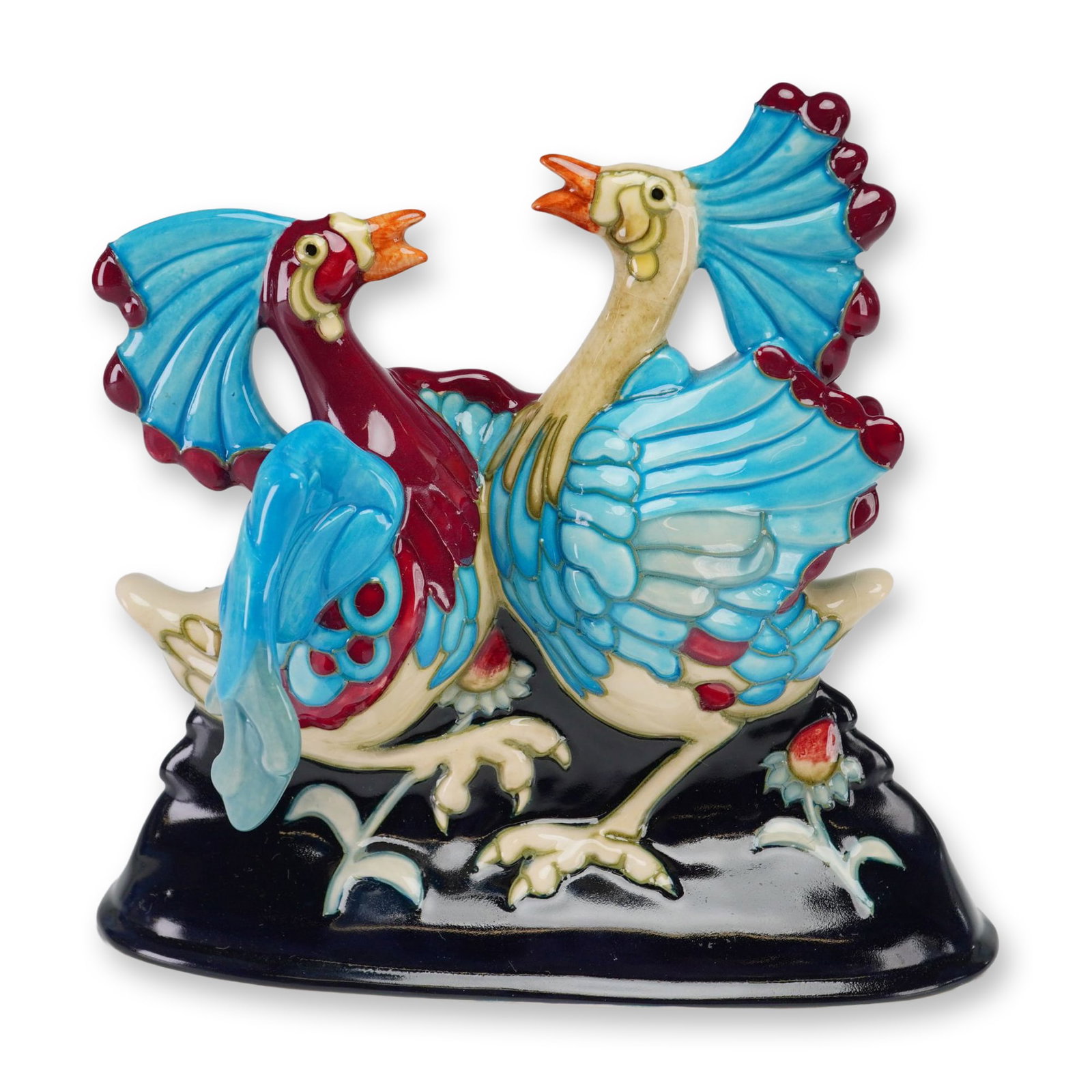 Moorcroft Pottery by Kerry Goodwin Figurine, Can Can Birds: A 2006 limited edition 18 out 75, depicts two exotic birds characterized by their large fan-shaped crests and vibrant plumage in shades of blue, burgundy, and cream. The birds are posed facing each ot