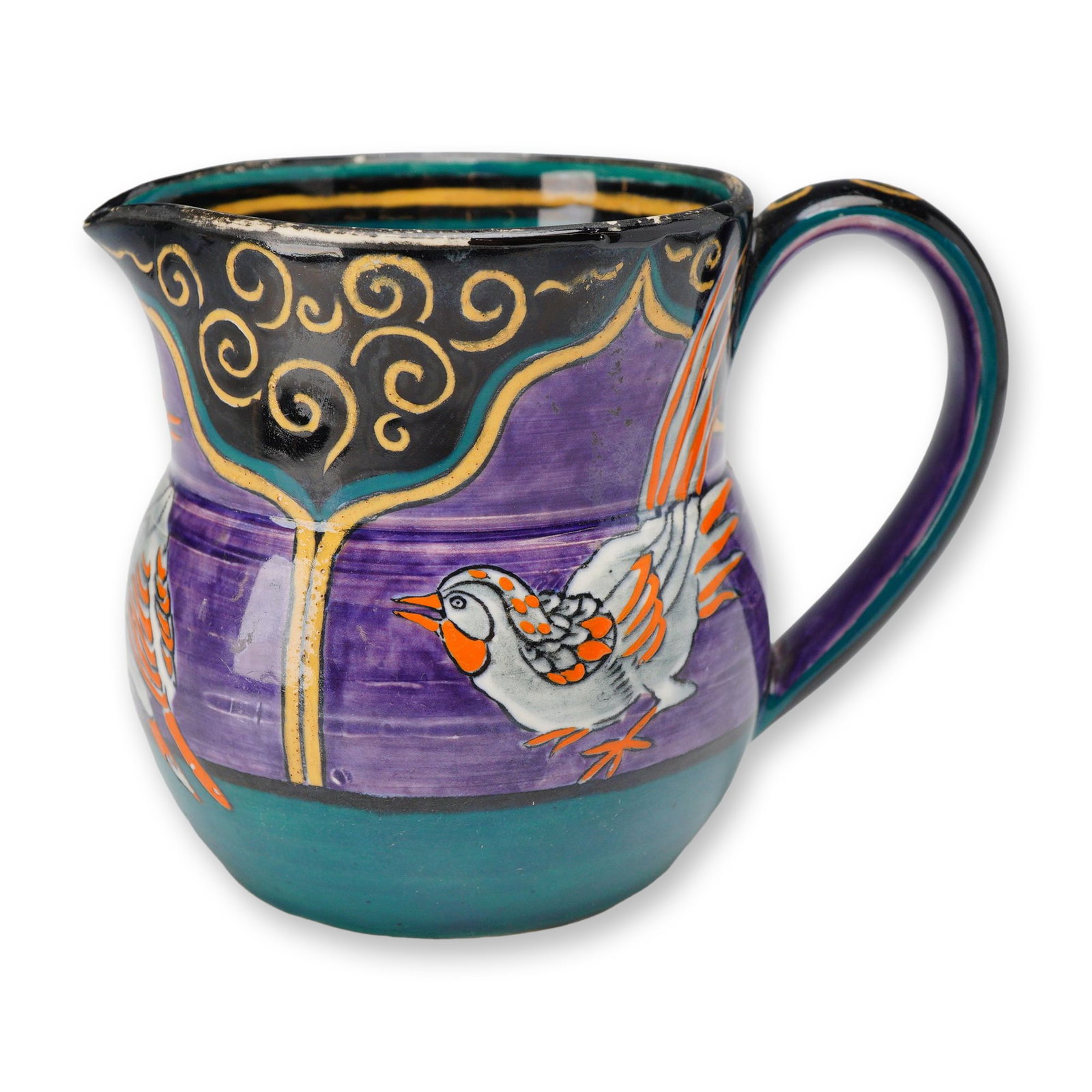 Wedgwood Jug Attributed to Daisy Makeig-Jones: A bulbous earthenware jug featuring hand-painted decoration attributed to designer Daisy Makeig-Jones for Wedgwood, circa 1920. The body of the jug features a deep purple glaze with two stylized birds