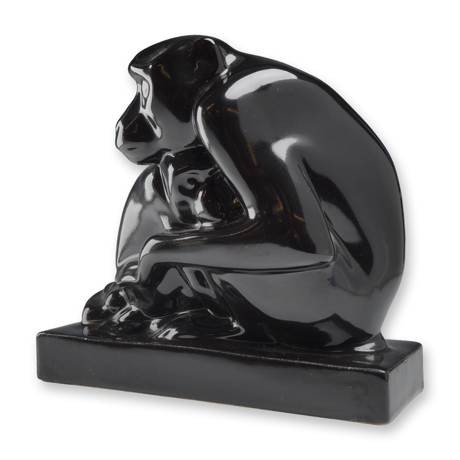 Wedgwood by John Skeaping Black Glazed Ceramic Monkey Figurine: A black-glazed ceramic sculpture depicting a seated chimpanzee mother cradling an infant, designed by artist John Skeaping for Wedgwood. This piece is part of the celebrated animalier series designed 
