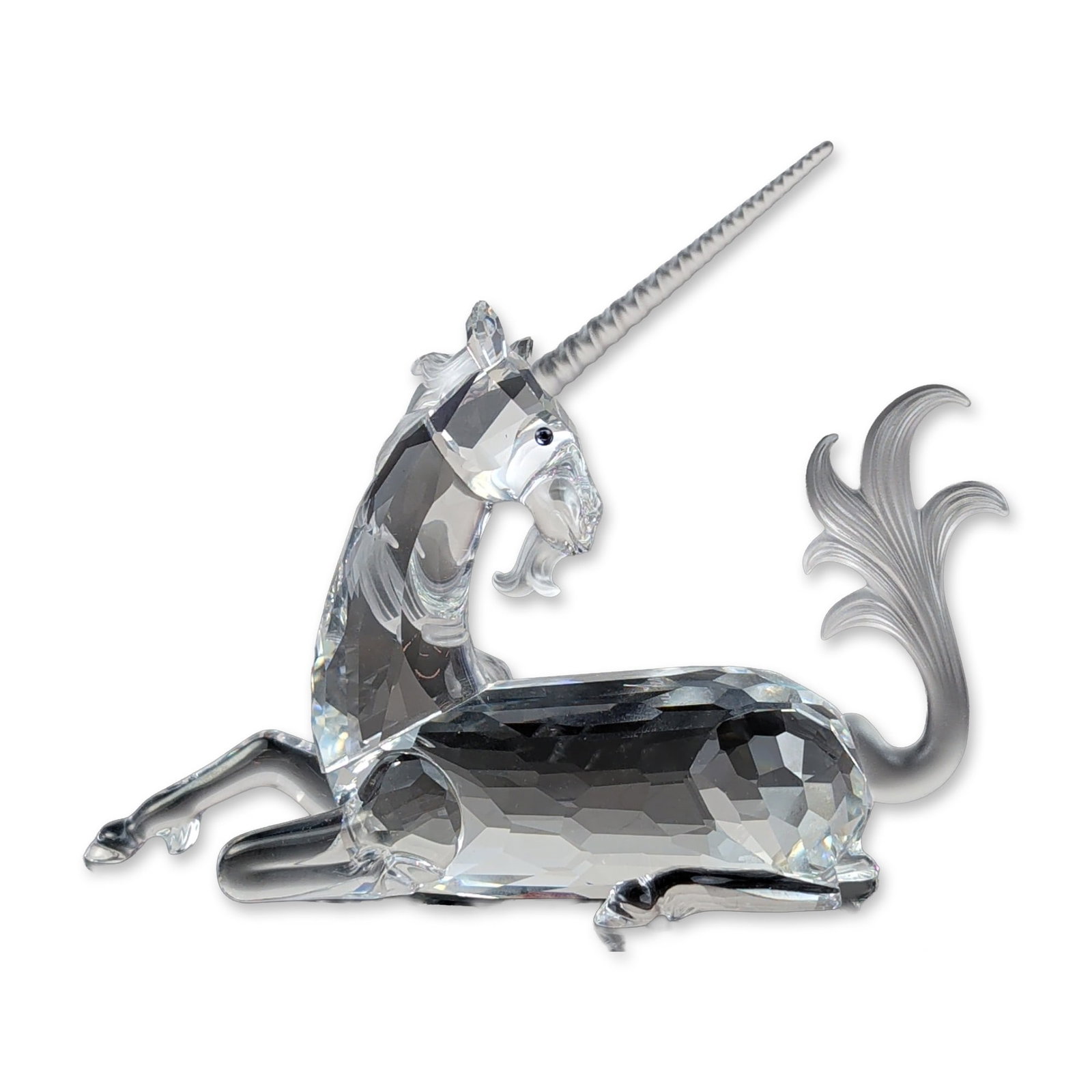 Swarovski SCS 1996 Unicorn Figurine: Swarovski crystal society annual edition figurine titled The Unicorn, released in 1996 as part of the Fabulous Creatures trilogy. The piece is constructed from faceted clear lead crystal with a froste
