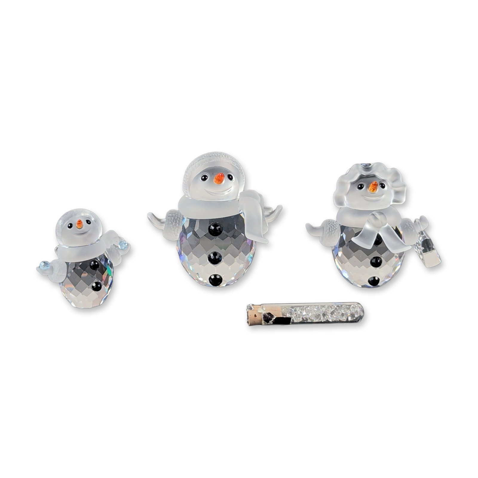 3pc Swarovski Faceted Crystal Snowman Figurine Family: Swarovski faceted lead crystal snowman figurine trio, snowman, snow woman, and snow child. Each piece is constructed from faceted lead crystal with frosted elements for the scarves and earmuffs, detai