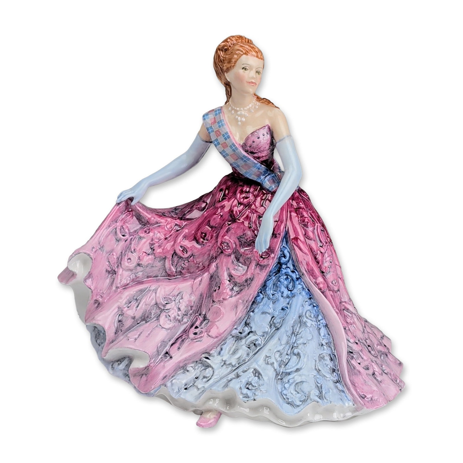 Royal Doulton Prototype Porcelain Pretty Lady in Pink and Blue Figurine: Modeled as a woman in a tiered pink ruffled gown featuring a blue scroll-patterned underside and a multi-colored plaid sash. Features hand-painted polychrome glazed decoration, light blue opera gloves