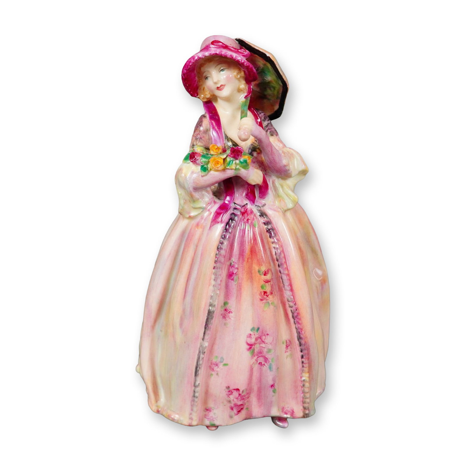 Royal Doulton Bone China Figurine, June HN2027: Part of the Harradine Classics series, this hand-painted porcelain figure was designed by Leslie Harradine. The piece portrays a graceful woman dressed in a pink floral gown, holding a parasol and a b