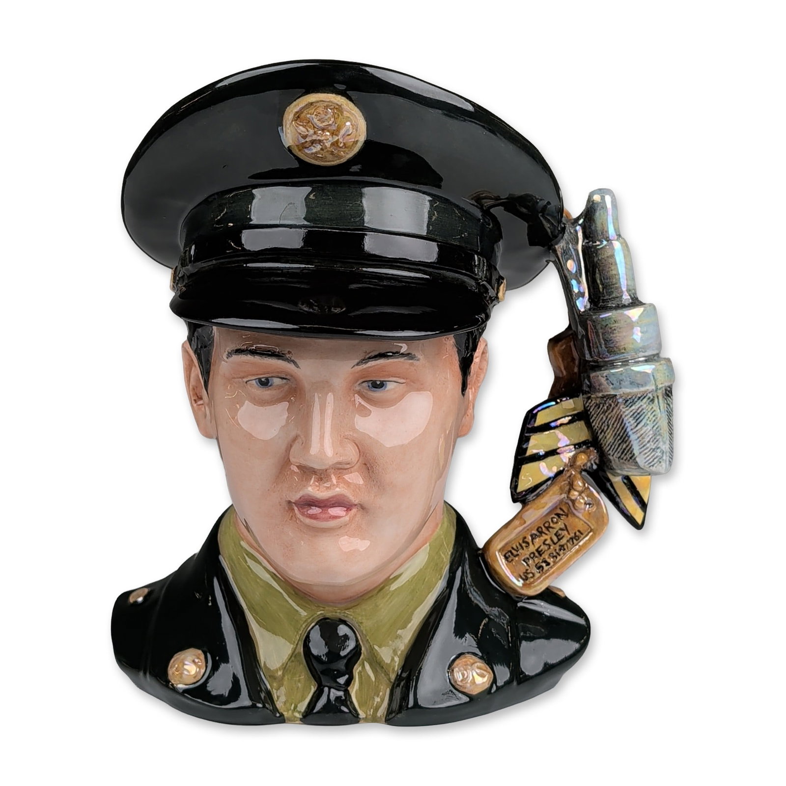 Royal Doulton Prototype Large Character Jug, GI Blues Elvis Presley EP9: Designed by Tim Potts. Depicting Elvis Presley in a United States Army uniform. The figure is modeled wearing a dark army-green service cap with luster gold-tone emblem, olive drab shirt, black tie, a