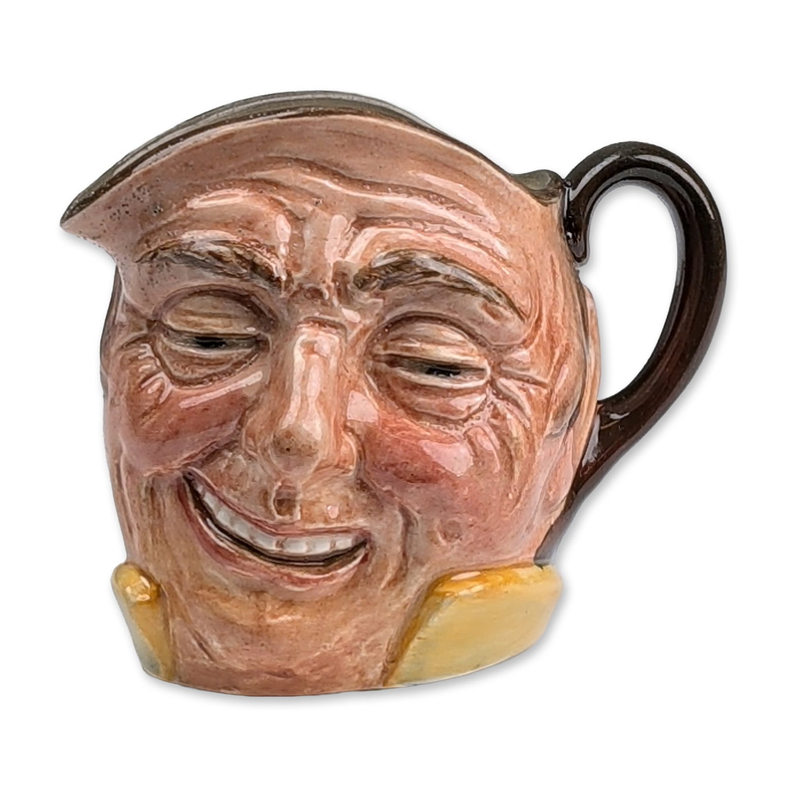 Royal Doulton Colorway Small Character Jug, Farmer John D5789 - Handle Outside: Featuring a winking expression, wide grin, pale yellow collar, and dark brown hat forming the rim and handle. The side of the body is incised with the character name and a wheat stalk motif. Underside