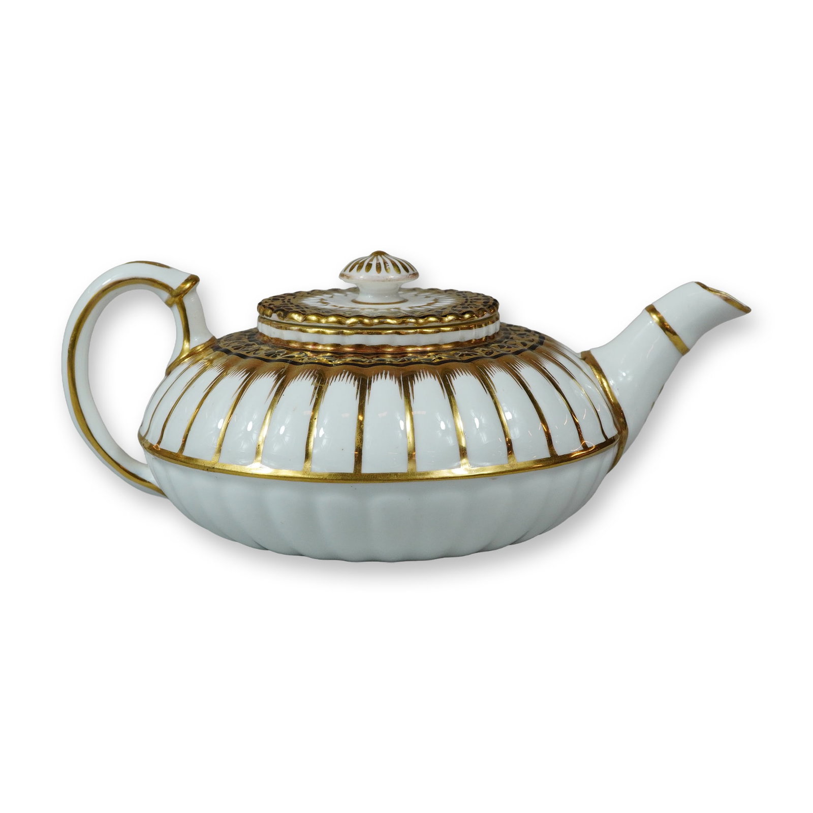 Wedgwood Fluted Gilt Porcelain Teapot: This early 19th-century porcelain teapot from Wedgwood. The vessel features a squat, globular body with deep vertical fluting and a matching lid topped with a circular knob finial. It is fitted with a