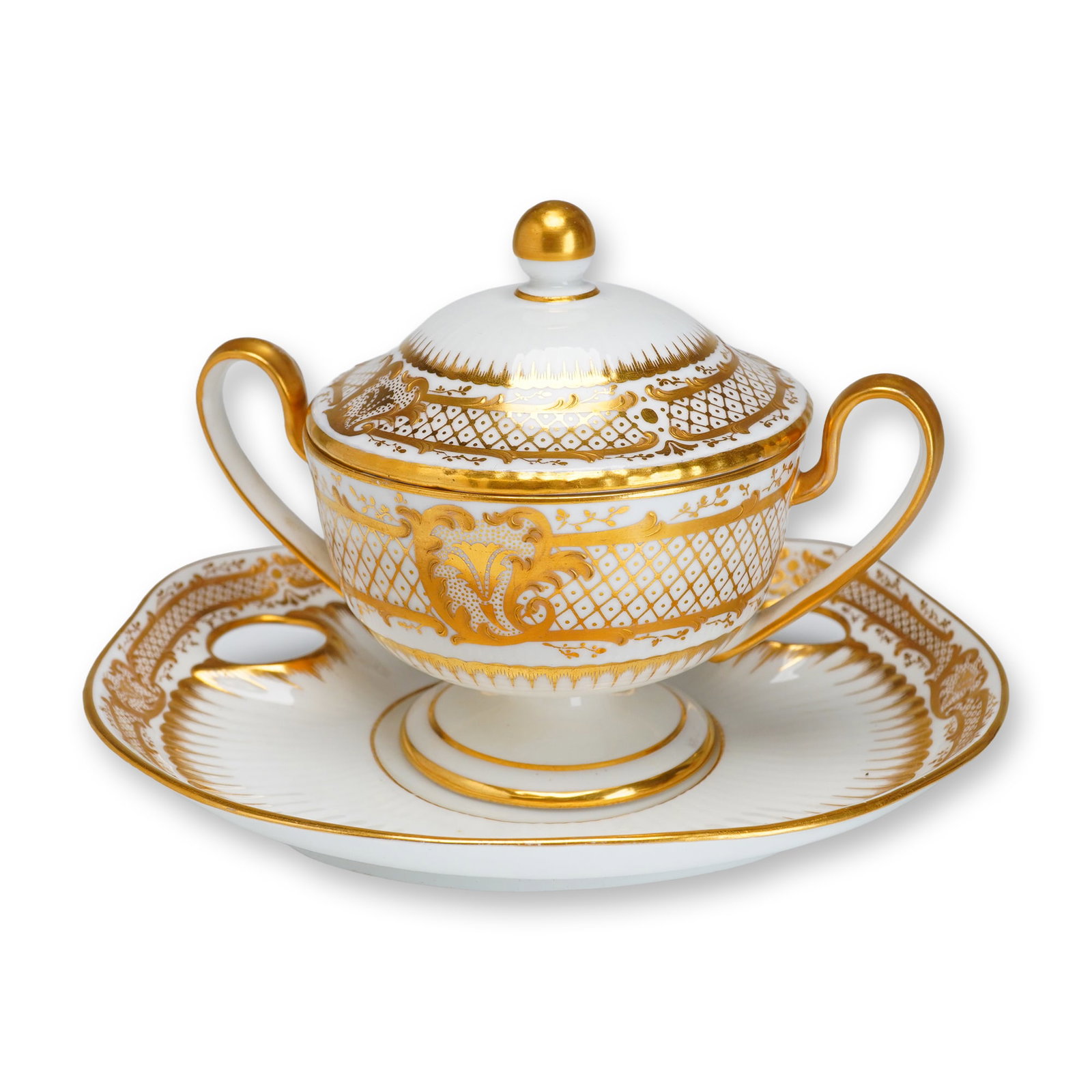 Wedgwood Porcelain and Gilt Lidded Sugar Bowl with Tray, circa 1920: A two-piece fine bone china set produced by Wedgwood, consisting of a lidded sugar bowl and a matching trembleuse stand or tray. The bowl features a pedestal foot, twin scrolling handles fully decorat