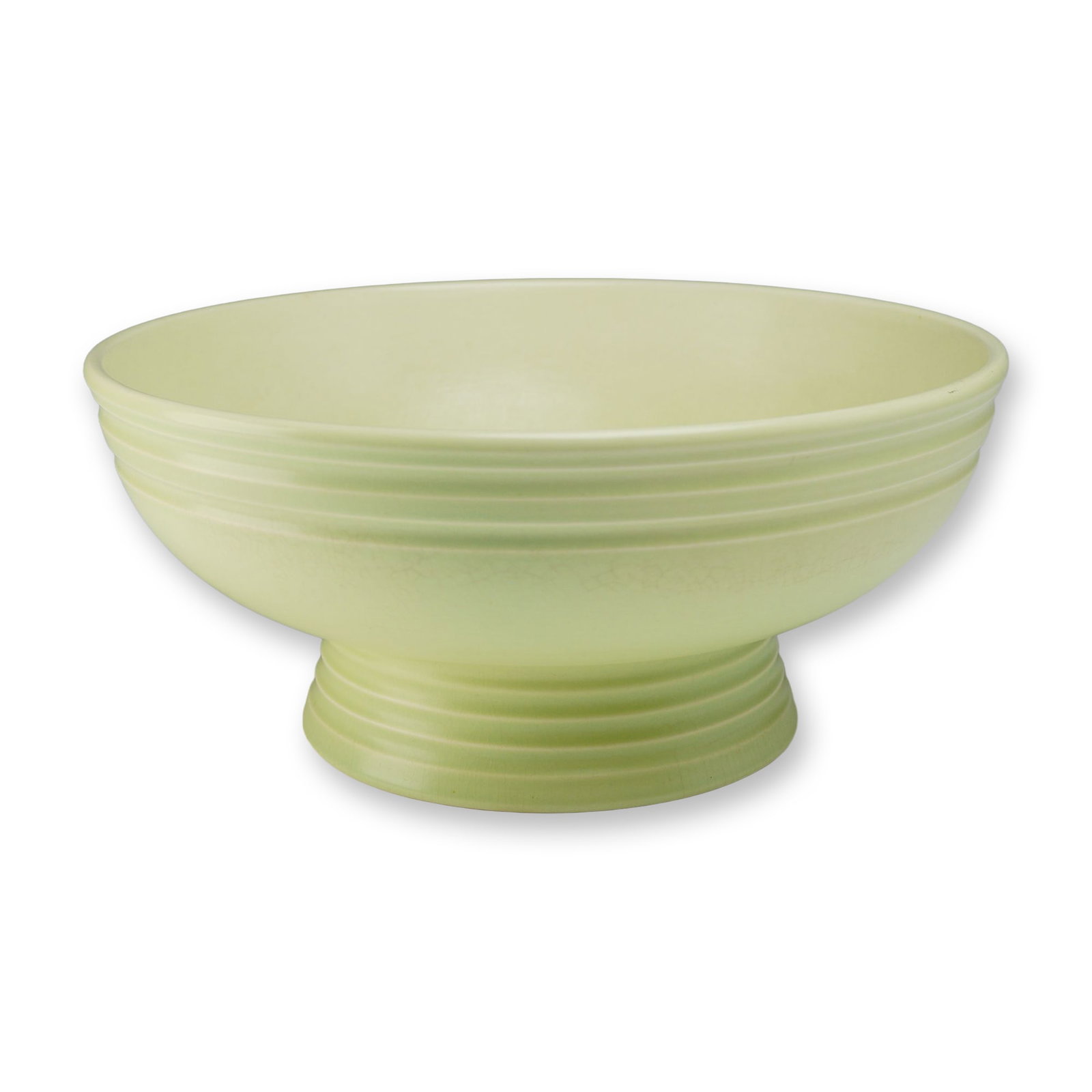 Keith Murray for Wedgwood Art Deco Earthenware Footed Bowl: This circular earthenware footed bowl is a design by Keith Murray for the Wedgwood factory. The piece features a deep interior well and is supported by a flared, tiered circular foot. Both the exterio