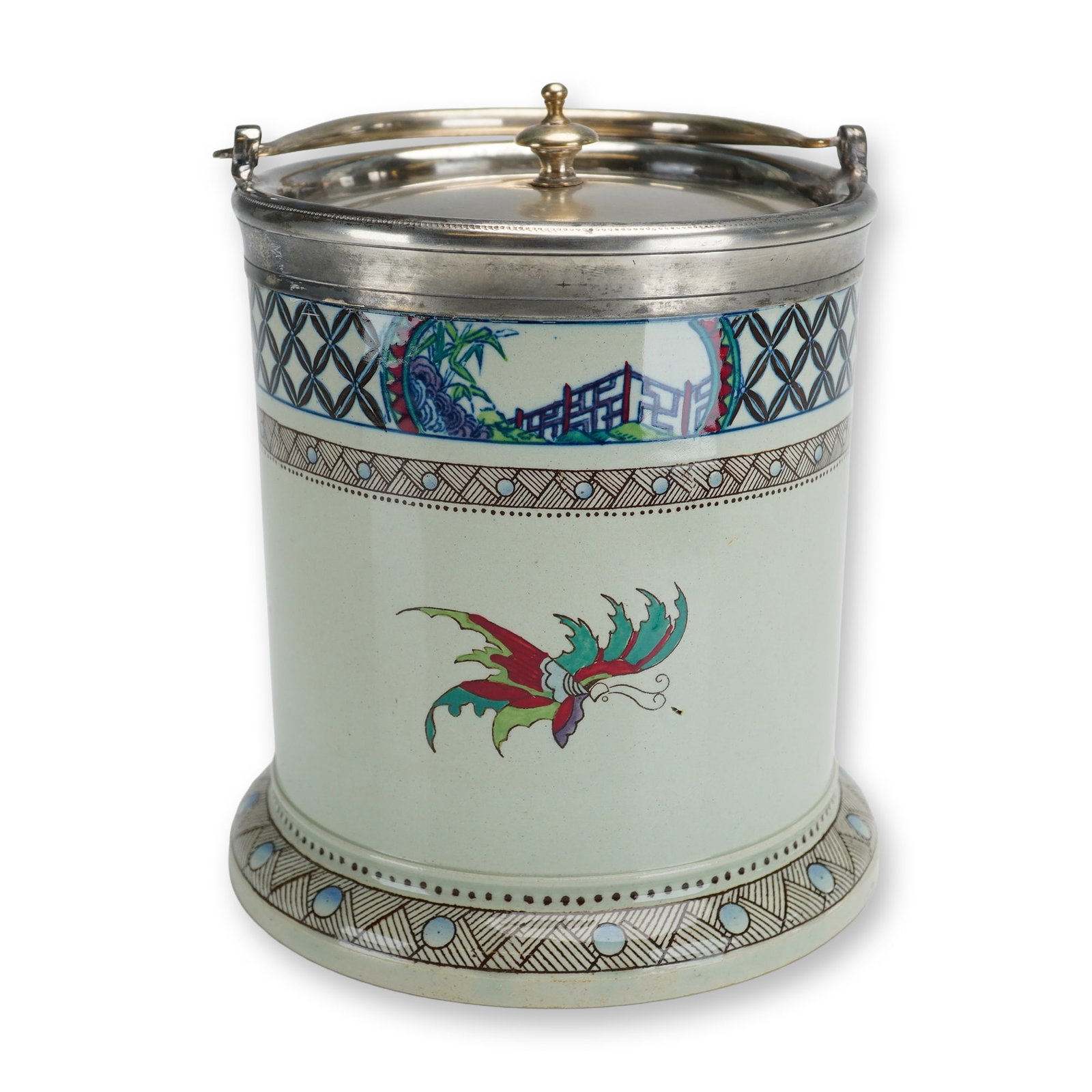 Wedgwood Etruria Polychrome Butterfly Ceramic Biscuit Barrel: A Wedgwood Etruria ceramic biscuit barrel of cylindrical form with a flared foot. The vessel is finished in a pale celadon green glaze and decorated with hand-enameled polychrome butterflies in