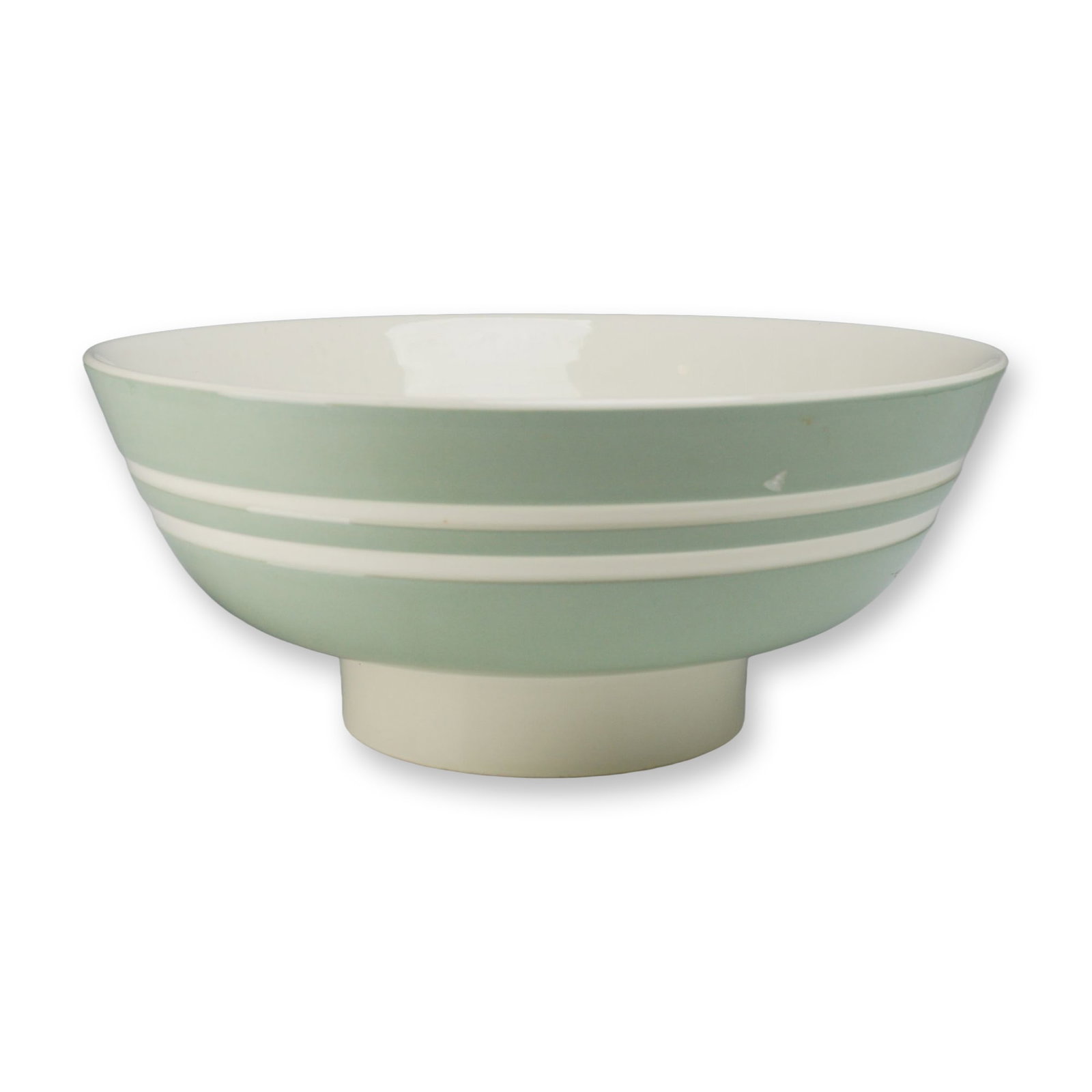 Keith Murray for Wedgwood Art Deco Celedon Green and White Footed Center Bowl: A large circular earthenware footed center bowl designed by Keith Murray for Wedgwood. The piece features a deep well and is supported by a tapering pedestal foot. The exterior body is finished in a m