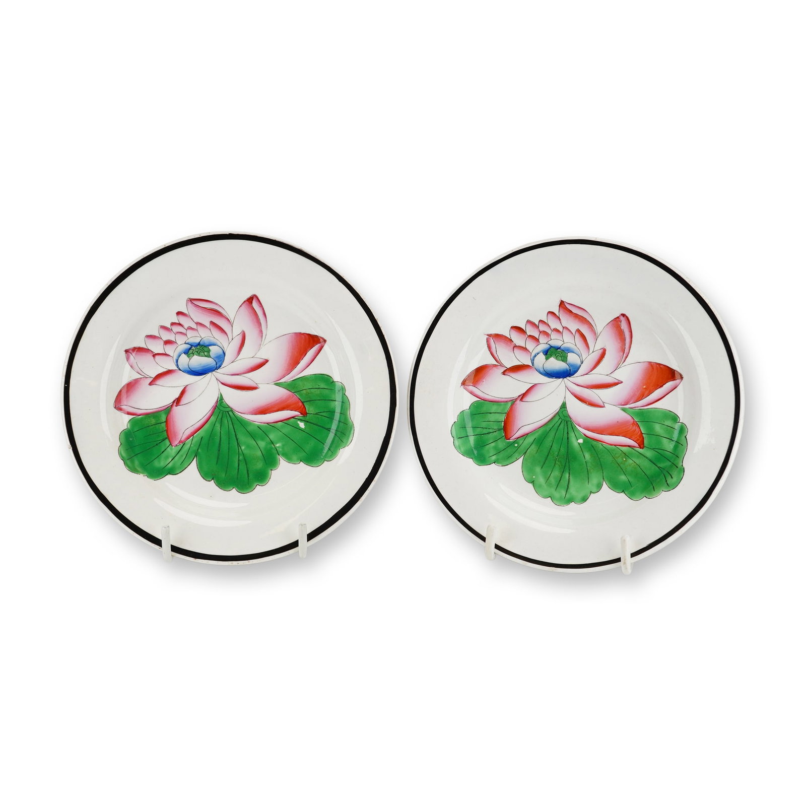 2pc Wedgwood Hand Painted Lotus Flower Ceramic Miniature Plates: A pair of hand painted creamware ceramic miniature plates manufactured by Wedgwood in Burslem, Staffordshire, England. Each plate features a centrally positioned lotus blossom rendered in overglaze