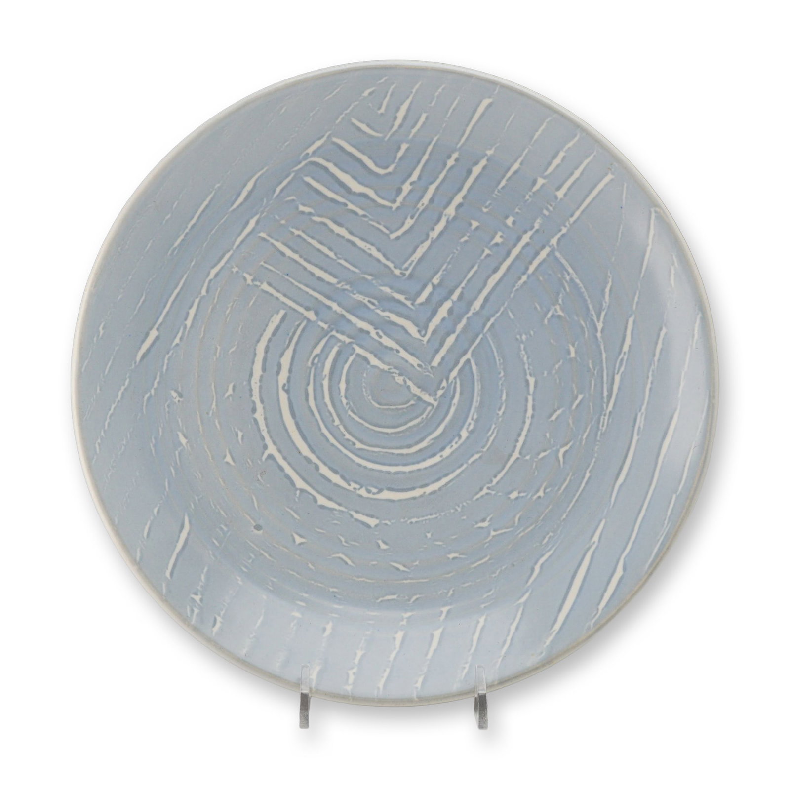Rare Wedgwood Earthenware Plate, circa 1950: This mid-century modern ceramic plate, produced by Wedgwood, is crafted from earthenware and features a striking modernist abstract design. The shallow circular form is decorated with a light blue gro