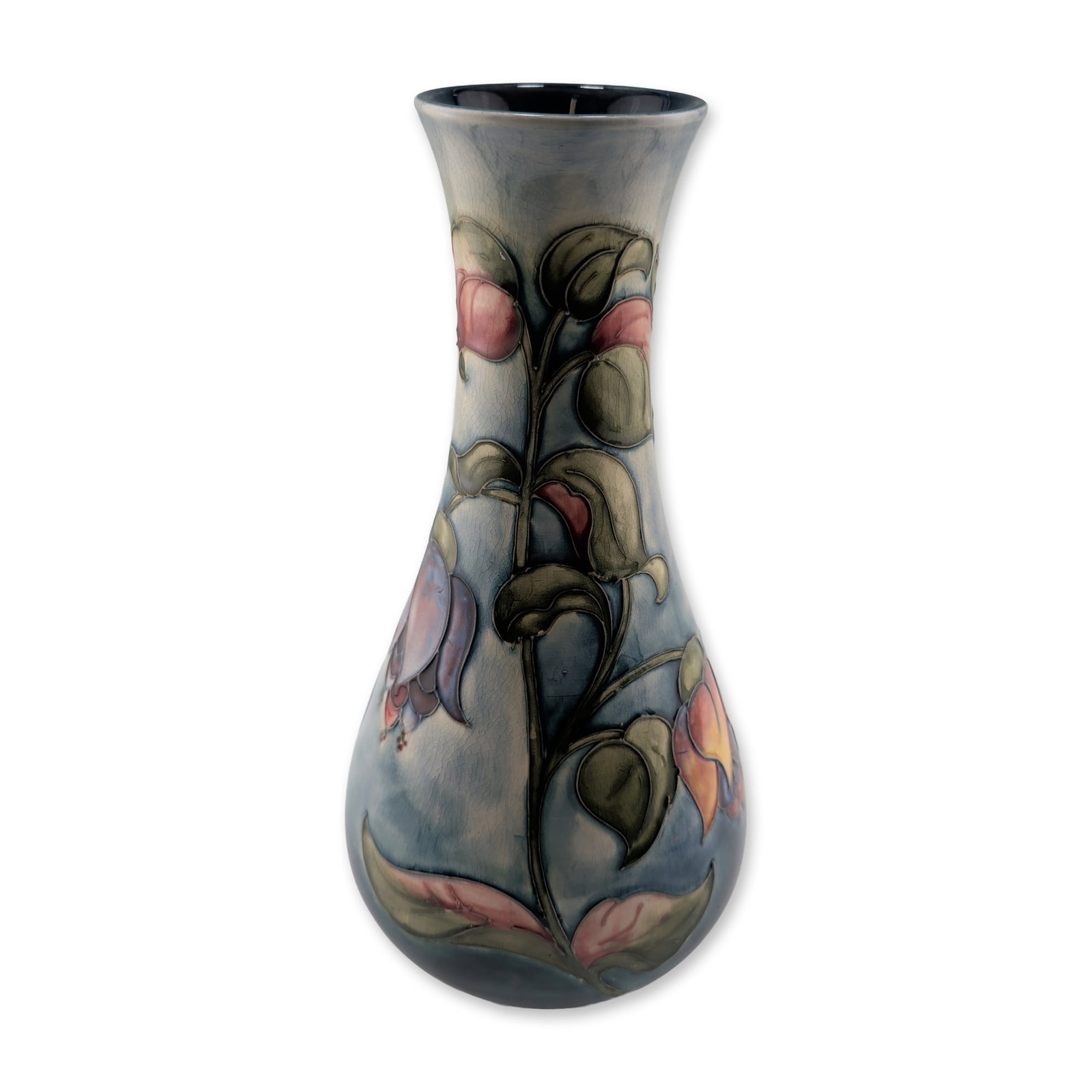 Moorcroft Vintage Large Pottery Vase, Fuchsia: This baluster-form vessel features a bulbous base and flared neck, decorated with hand-painted fuchsia blossoms in shades of pink, lavender, and yellow amidst dark green foliage. The floral motifs are