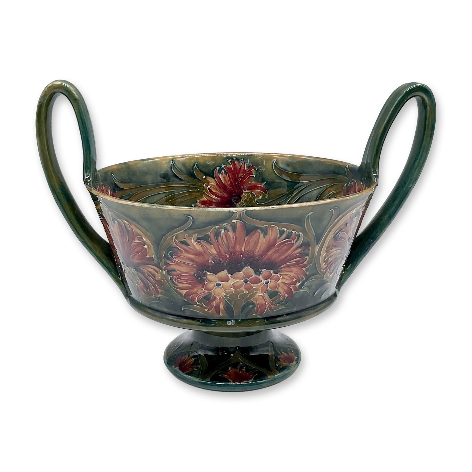 Macintyre by Moorcroft Double-Handle Bowl, Cornflower: A footed bowl with two narrow handles. Green glazed ground with yellow shading, featuring a red thistle garland. Macintyre Burslem England backstamp. Artist signed. Circa 1912 Artist: William Moorcrof