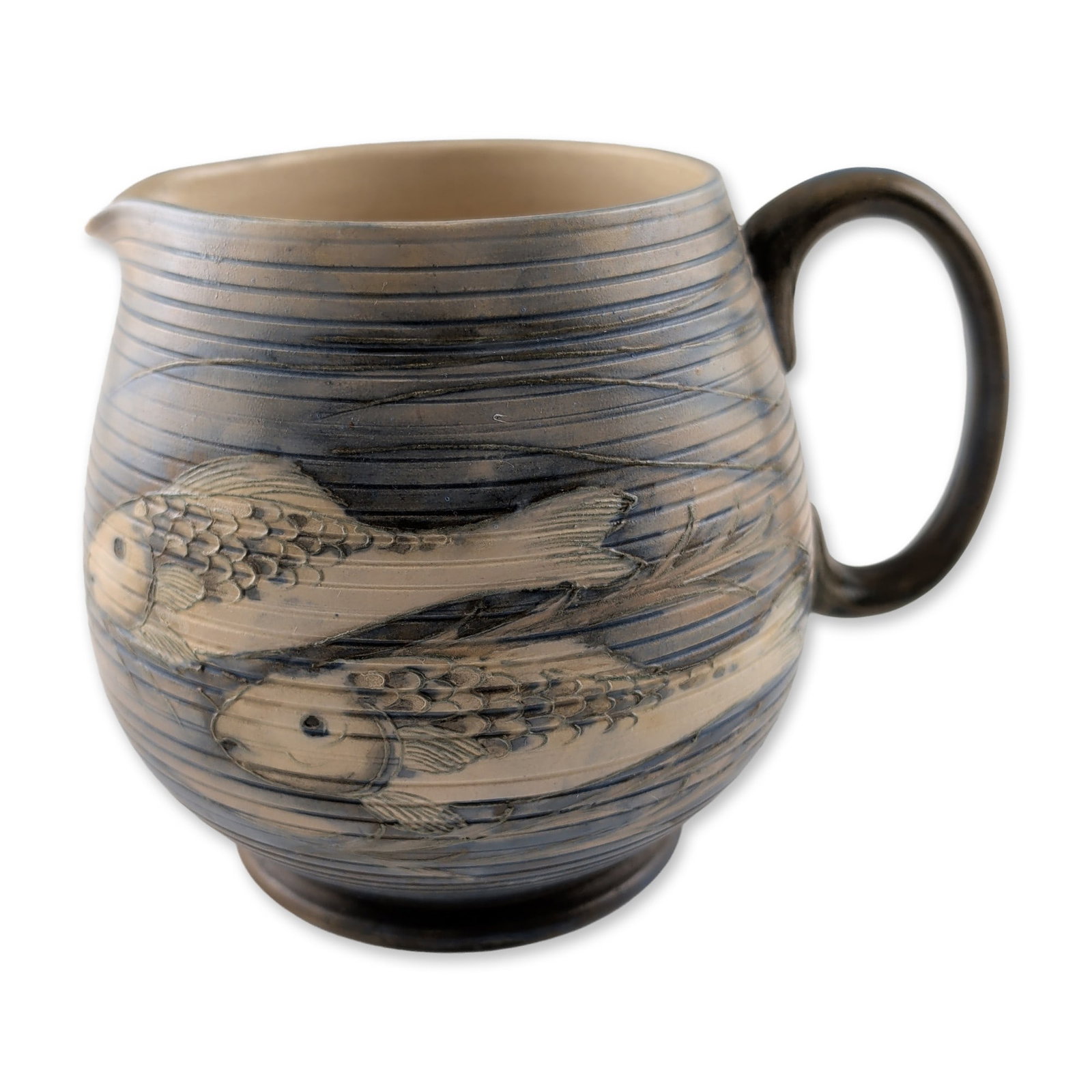 Moorcroft Pottery Rare Vintage Saltglaze Fish Pitcher: Moorcroft Pottery ceramic pitcher in a bulbous form with a pinched spout and loop handle. The body features a sgraffito design depicting fish swimming through horizontal linear bands representing wate