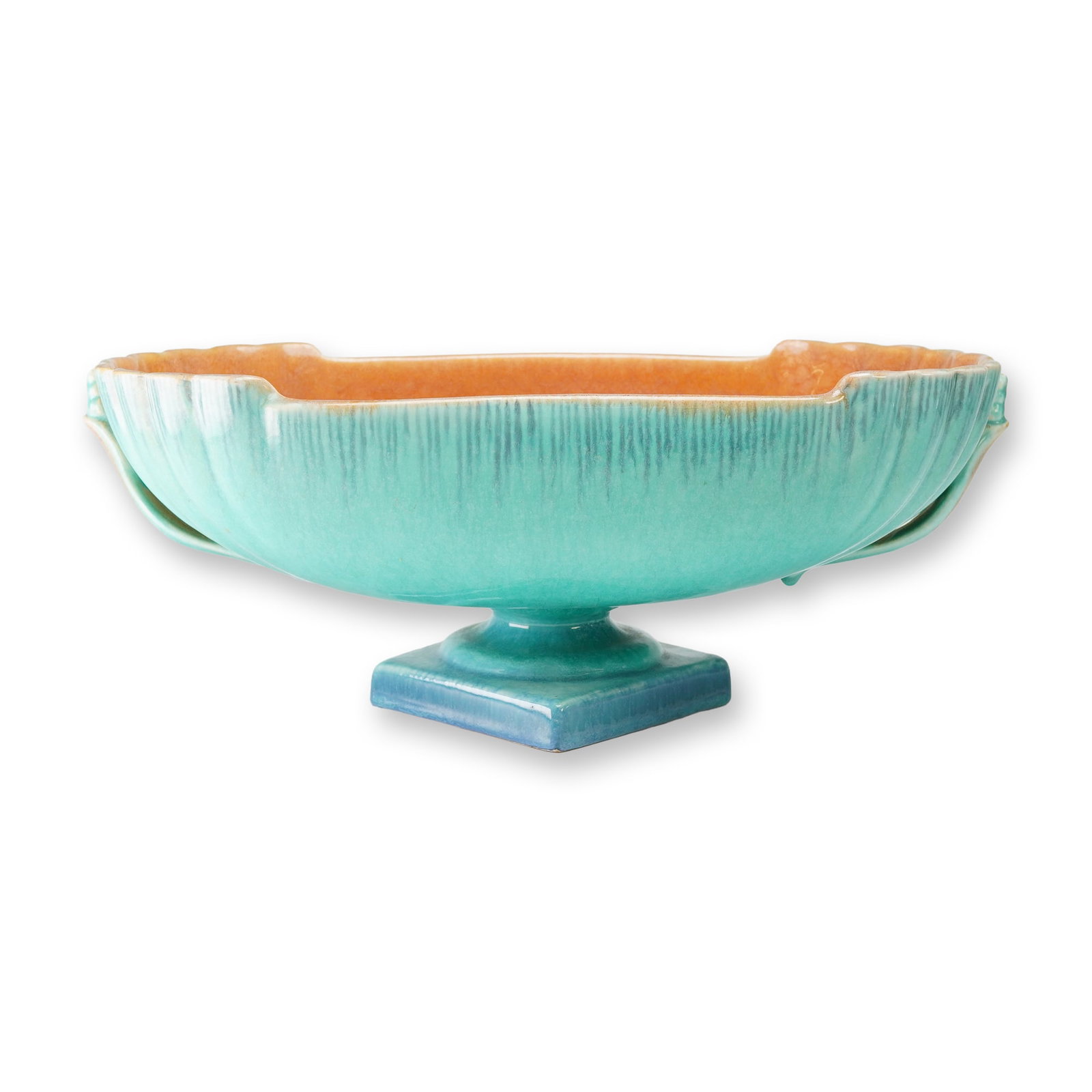 Roseville Pottery Turquoise and Salmon Centerpiece Bowl, Orian: This ceramic centerpiece bowl was introduced circa 1935. The piece features an elongated, boat-like form with a turquoise blue glazed exterior and a contrasting salmon-colored interior. The exterior b