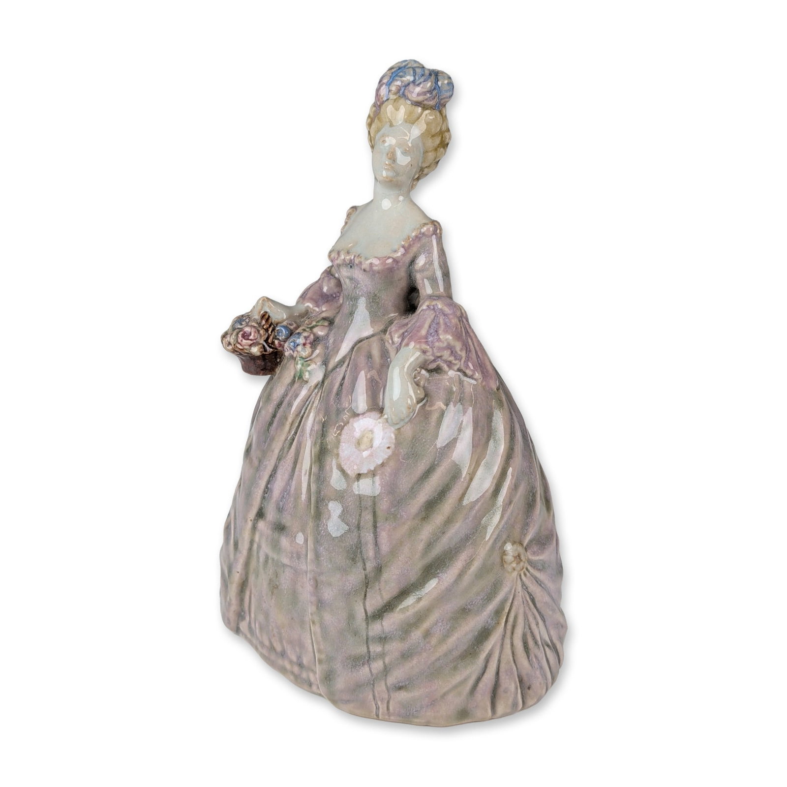 Doulton Lambeth by John Broad Stoneware Colored Figurine, Madame Pompadour: Glazed porcelain figurine depicting a lady in an 18th-century style crinoline gown with a fitted bodice and heavy, stylized folds. The figure is modeled holding a small basket of flowers in her right 