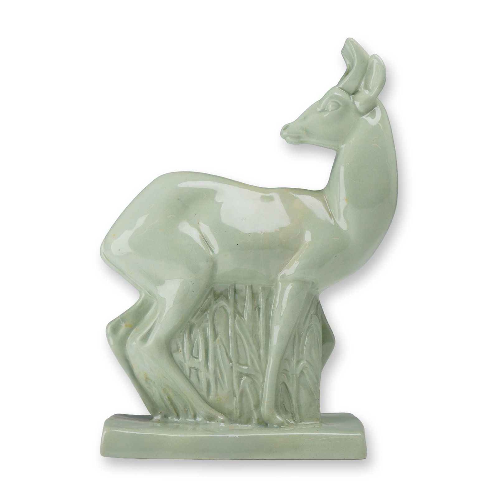 Wedgwood by John Skeaping Art Deco Celadon Glazed Figurine, Fallow Deer: The piece features a stylized deer standing amidst tall, simplified grasses on a rectangular integral base, looking back over its shoulder. It is crafted from earthenware and finished in a monochrome 