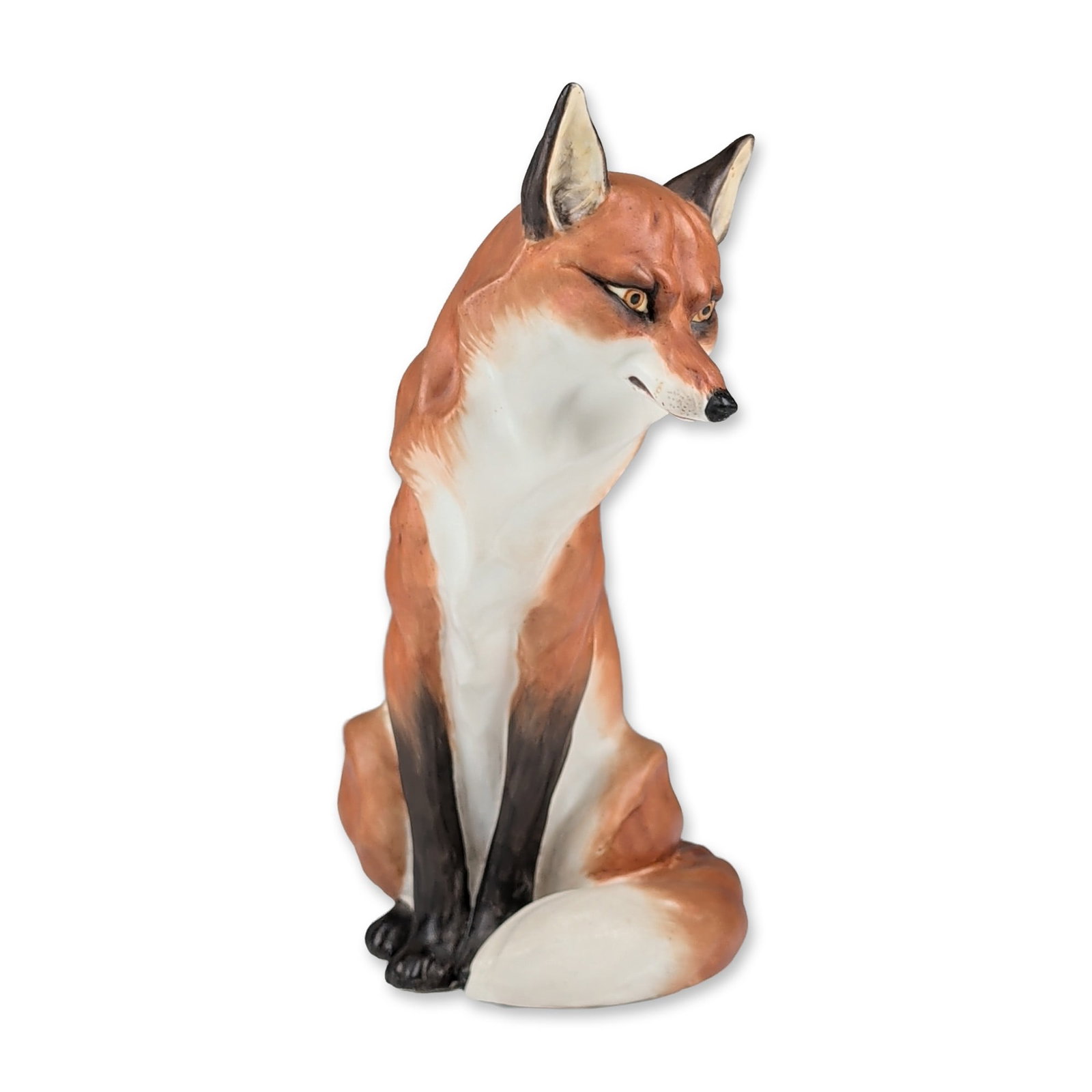 Royal Worcester by Doris Lindner Bone China Figurine, Seated Fox 2993: Fine bone china crafted with hand painted naturalistic decoration depicting orange red fur, a white chest and tail tip, and black highlights on the ears and legs. The figure is modeled in an attentive