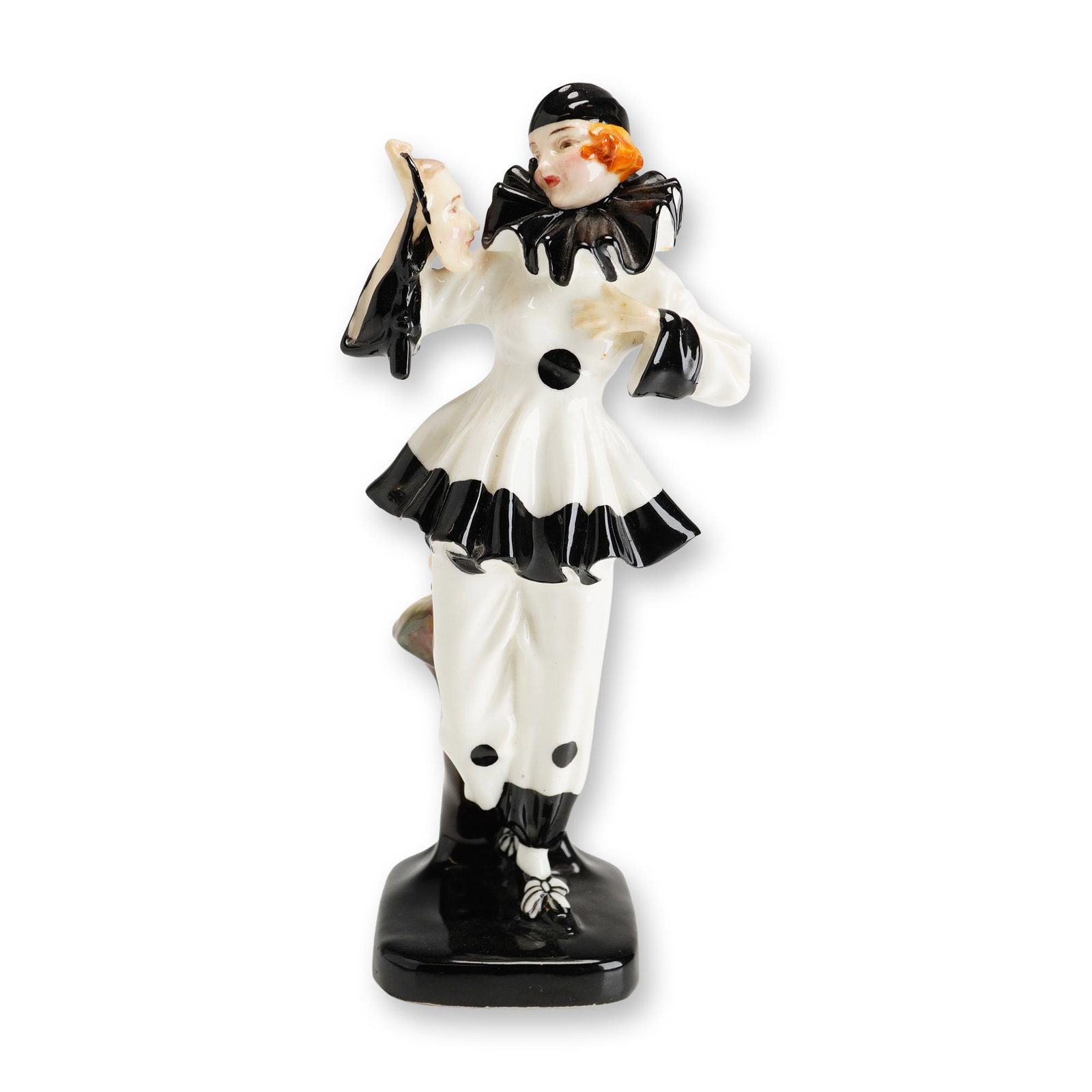 Royal Doulton Porcelain Figurine, The Mask HN657: Part of the Commedia dell'Arte series, designed by Leslie Harradine and inspired by traditional Italian theatrical characters. This black and white figure depicts a female Harlequin in classic clown c