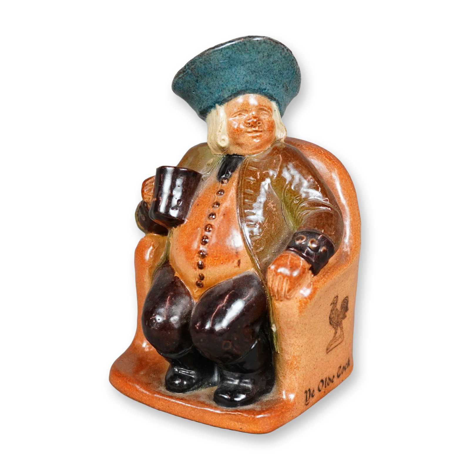 Royal Doulton Lambeth Stoneware Salt-Glazed Advertising Armchair Toby Jug, Ye Olde Cock Tavern: Designed for "The Old Cock Tavern", this hand painted salt-glazed figure depicts a seated man with in a button shirt, shown holding a mug of ale. Royal Doulton Lambeth impressed stamp on the underside