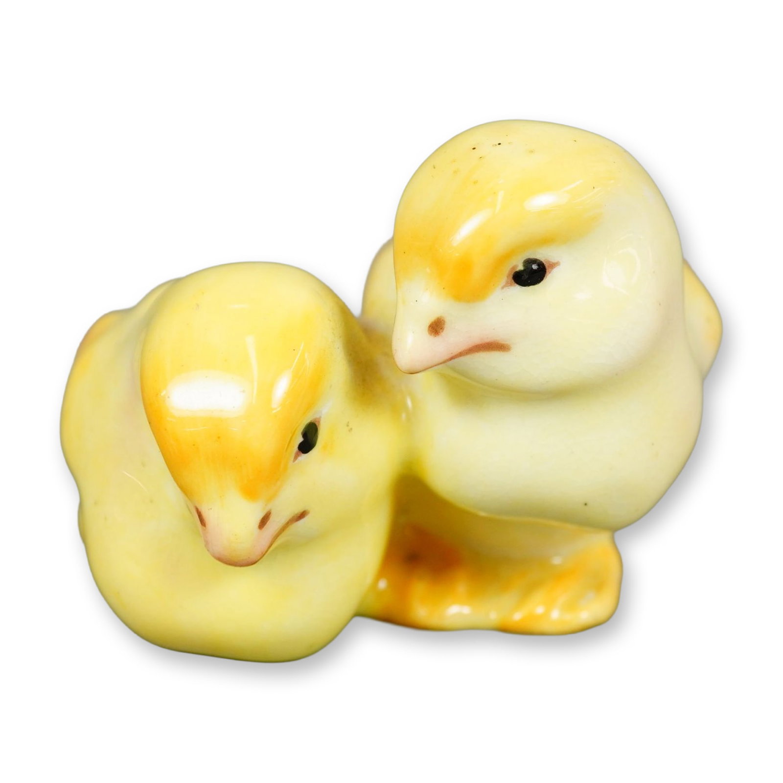 Royal Doulton Colorway Porcelain Bird Figurine, Chicks HN236: Hand-painted figurine of two baby chicks nestled together, featuring soft yellow tones with deeper yellow shading and black eyes. Includes Royal Doulton backstamp. Dimensions: 2.75"L x 2.5"W x 2"H Man