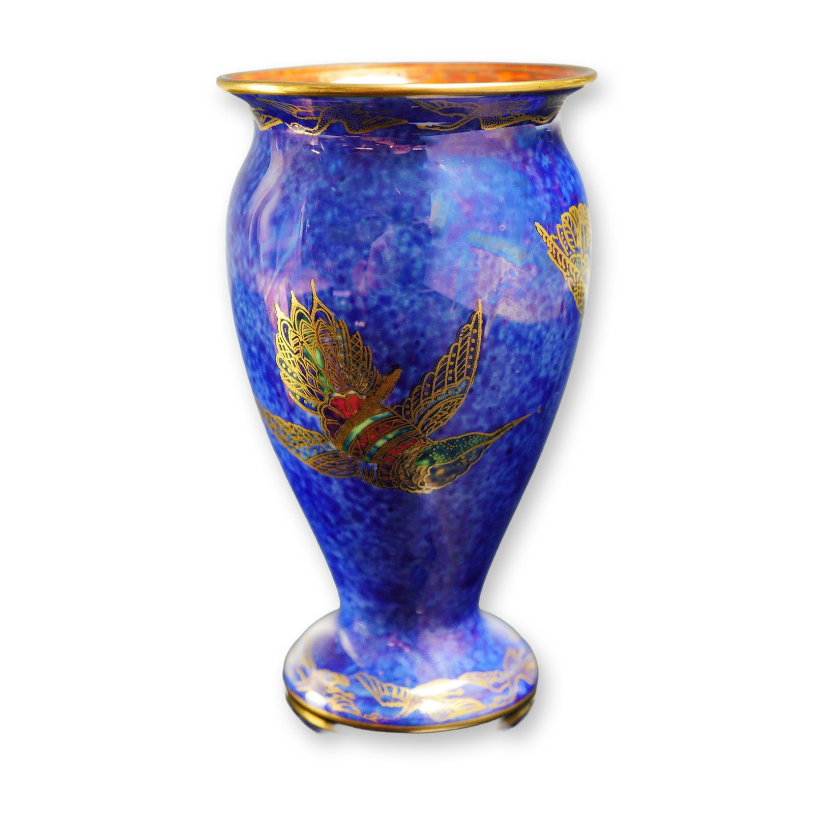 Wedgwood Fairyland Lusterware Hummingbird Vase: Designed by Daisy Makeig-Jones. Small vase featuring a mixed blue exterior luster glaze, accented with gilt hummingbirds in green, red, and blue. The Flying Geese border decorates the top and bottom r