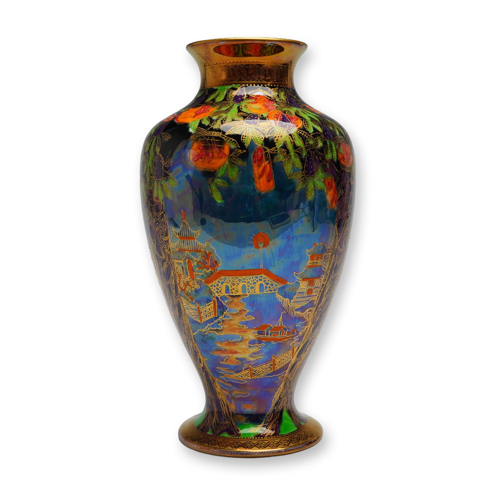 Wedgwood Fairyland Lustre Vase, Willow: A ceramic vase of baluster form, executed in the highly decorative Wedgwood Fairyland Lustre technique. The vase features a deep, highly iridescent ground in tones of blue, purple, and gold. The decor