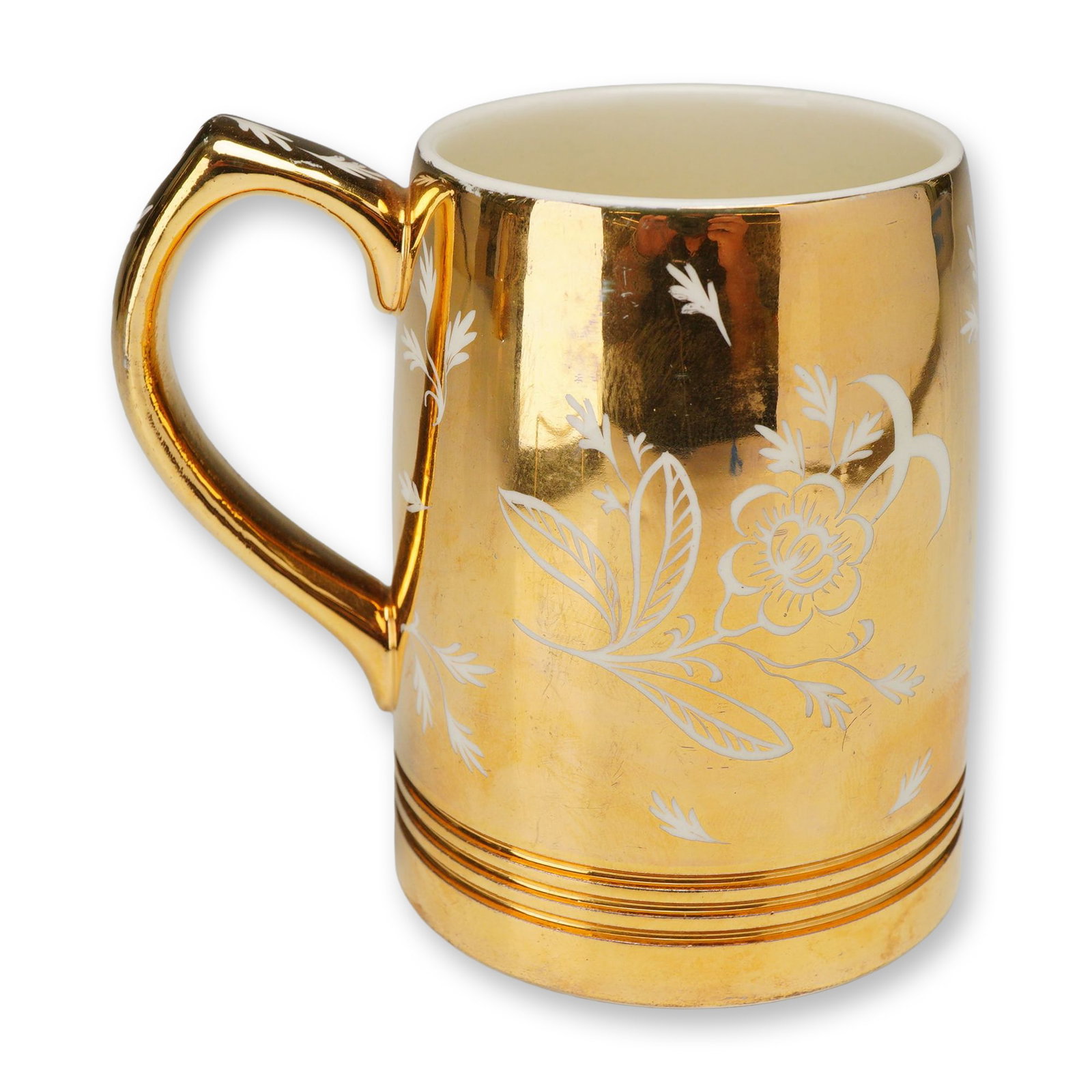 Wedgwood & Barlaston Keith Murray Small Porcelain Mug with Millie Taplin Floral Lustre: This c. 1940 form is a classic Murray design, characterized by a tapered cylindrical body with concentric molded rings at the foot and a sharp, angular loop handle. The exterior is finished in an all-