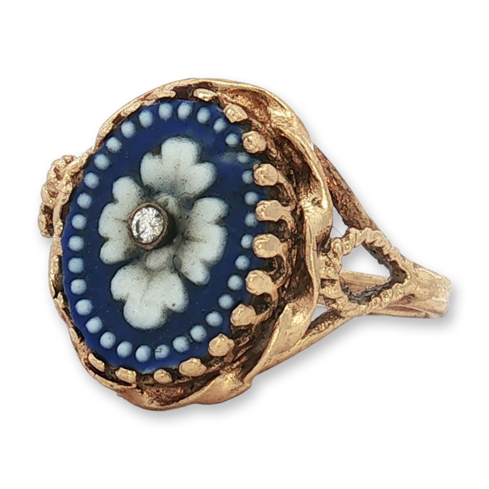 Wedgwood Jasperware 13K Yellow Gold and Diamond Ring: This ring features a centrally set oval Wedgwood Jasperware plaque with a matte deep blue ground decorated with a white bas-relief floral motif and a dotted border. A single round-cut diamond is set i