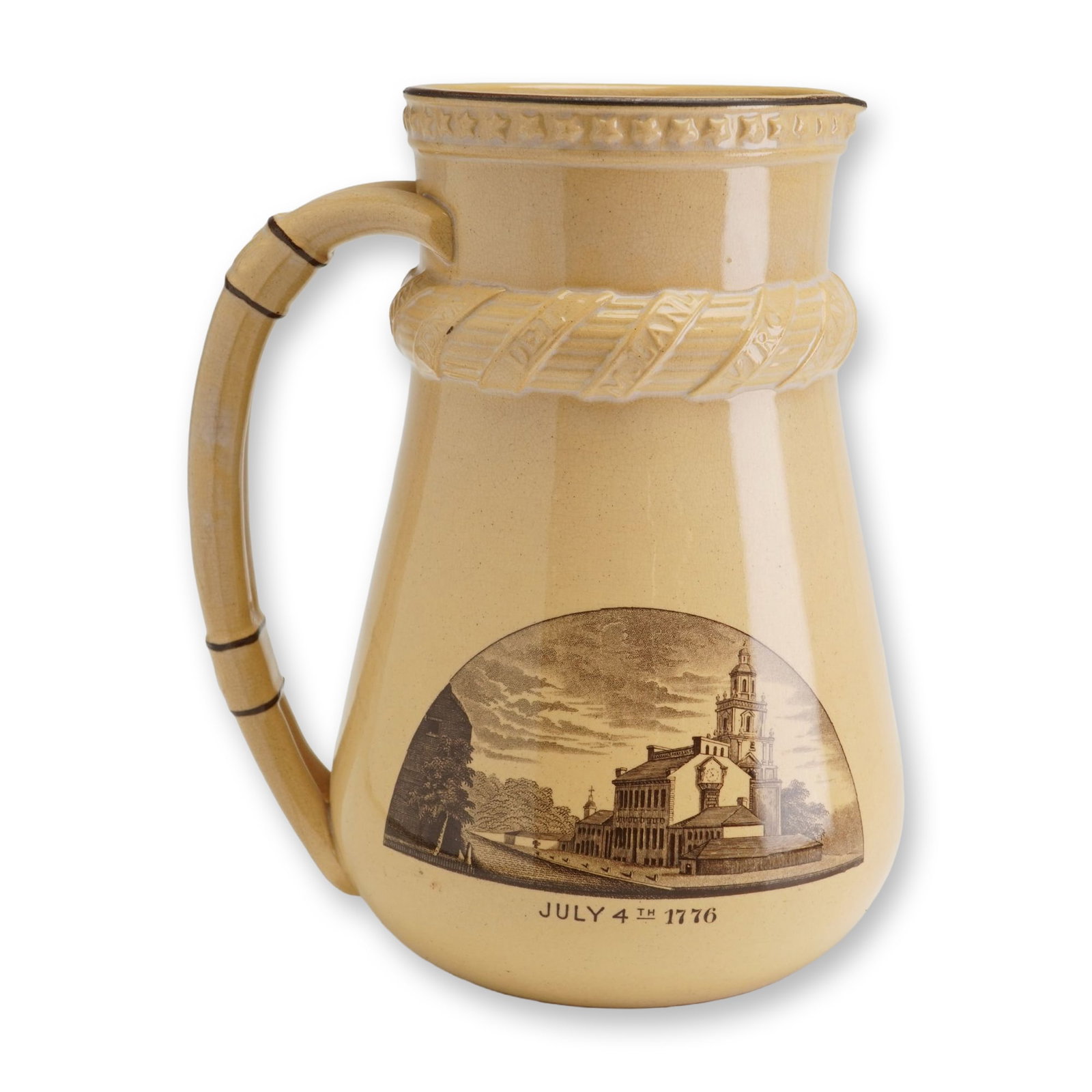 Wedgwood Centennial Exhibition Commemorative Glazed Pitcher July 4th 1876: A glazed yellowware or creamware commemorative pitcher produced by Wedgwood for the 1876 United States Centennial International Exhibition. The vessel is designed with a tall, tapered neck, a wide bul