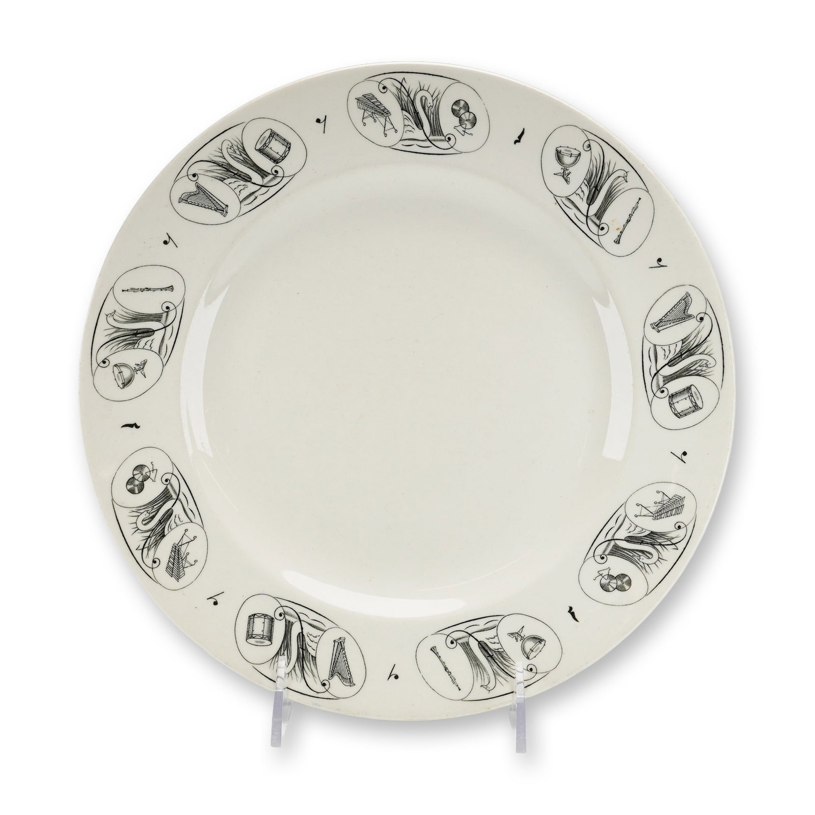 Wedgwood Sample Bone China Musical Theme Plate: This is a Wedgwood bone china sample plate featuring black transfer-printed designs by Eric Ravilious. The circular plate has a flat rim and a slightly recessed center. The decoration consists of six 