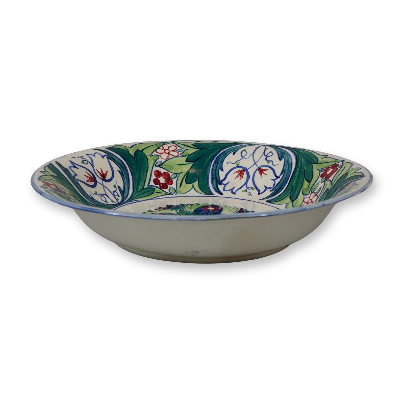 Wedgwood Etruria Hand-Painted Earthenware Bowl, Iznik Style: A wide, shallow circular bowl or charger made of glazed earthenware produced at the Wedgwood Etruria works. The interior features hand-painted underglaze decoration in an Arts and Crafts style heavily