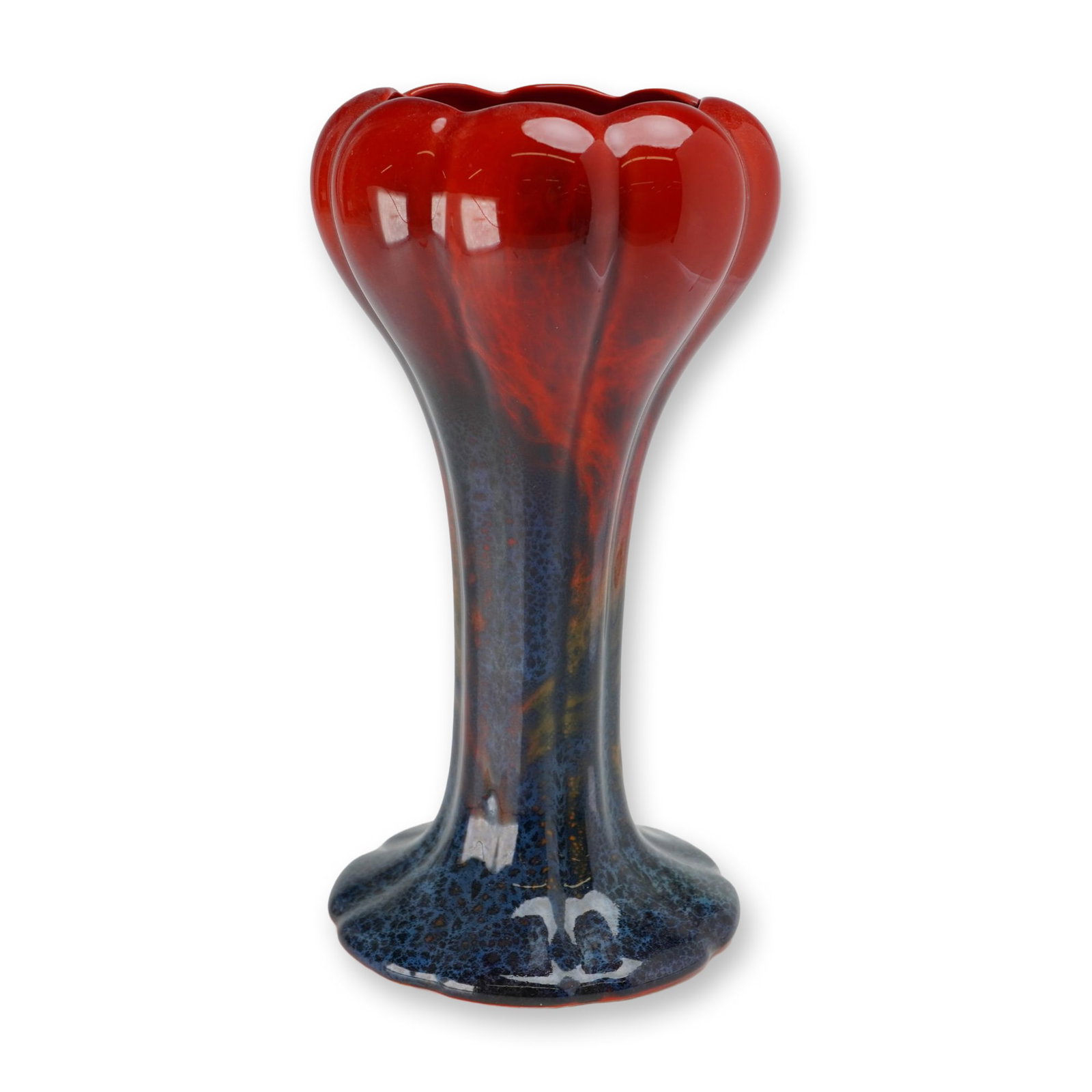 Royal Doulton Flambe Tulip Vase, 920: The vessel features a lobed tulip-form top tapering to a slender stem and flaring to a scalloped base. It is decorated in a high-gloss red flambe glaze that transitions down the stem into a mottled de