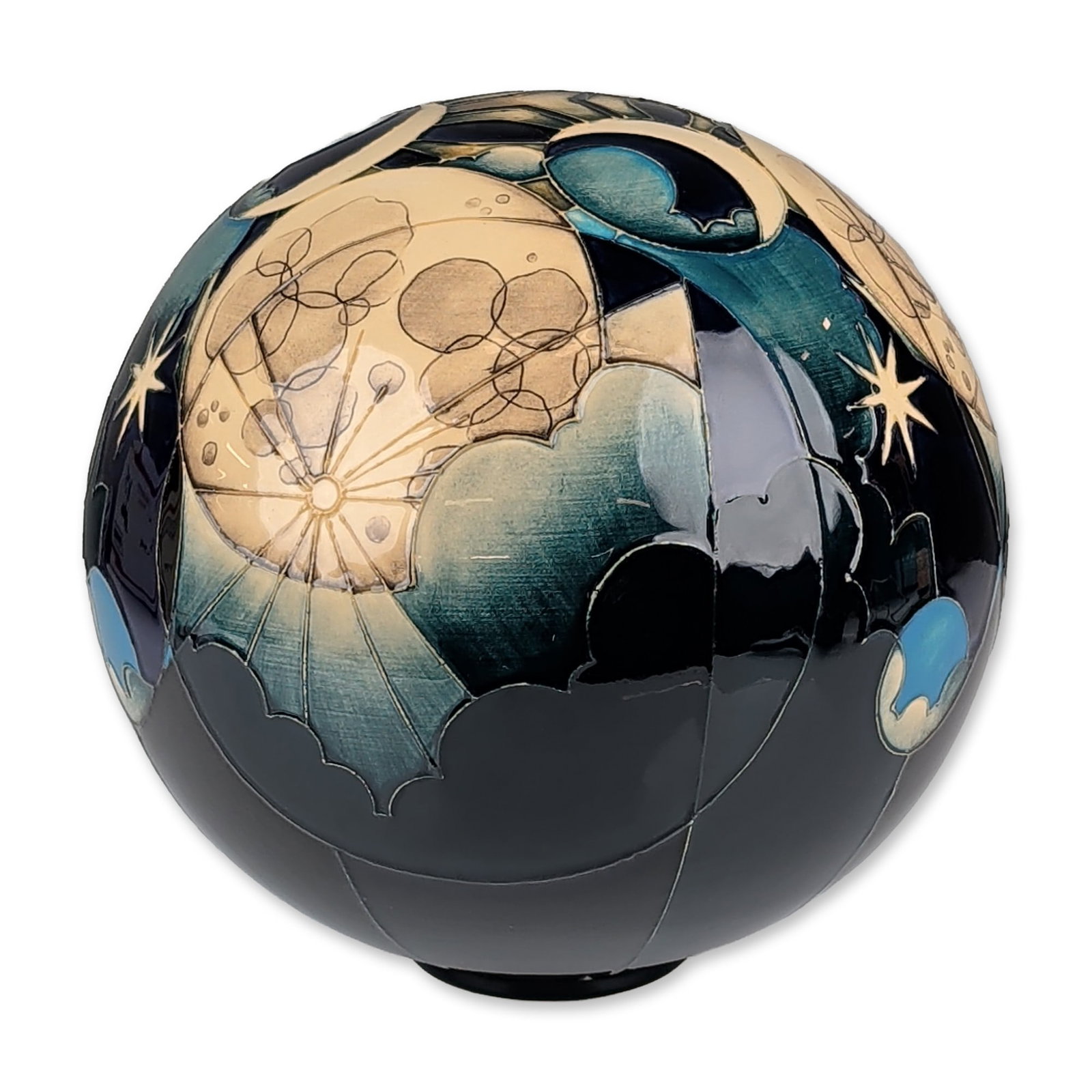 Moorcroft Pottery Trial Moonlight and Stars Globe Vase: The spherical body is decorated with celestial motifs including cratered full and crescent moons, stylized eight-pointed stars, and billowy cloud formations against a deep indigo and black ground, fin