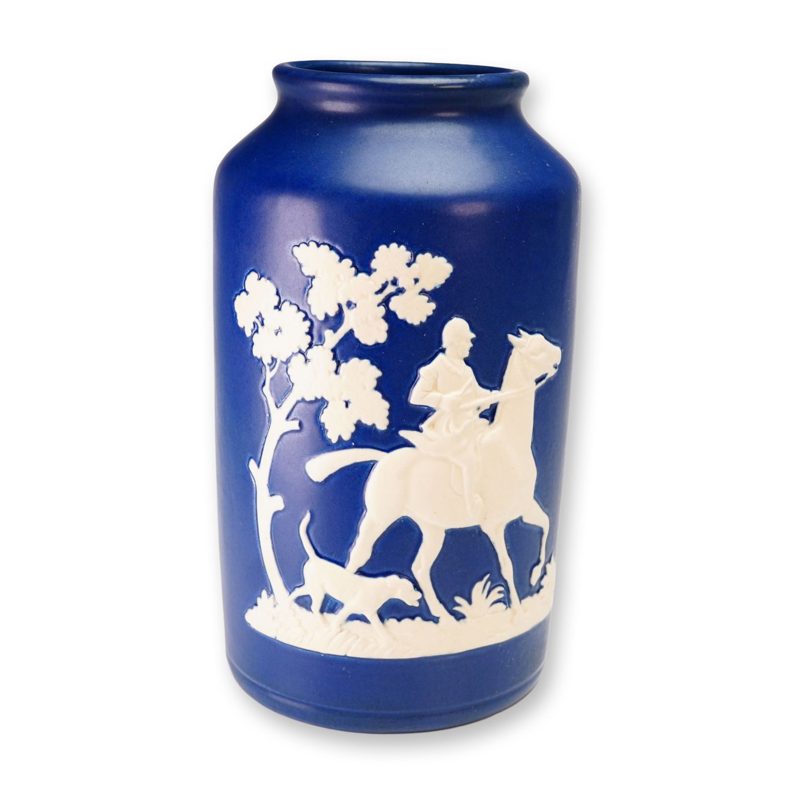 Weller Pottery Matte Cobalt Hunting Scene Vase, Chase: A fine cylindrical ceramic vase from the Chase line by Weller Pottery, Zanesville, Ohio, dating to the Art Deco period, circa 1920s. The vessel features a rich matte cobalt blue ground decorated with 