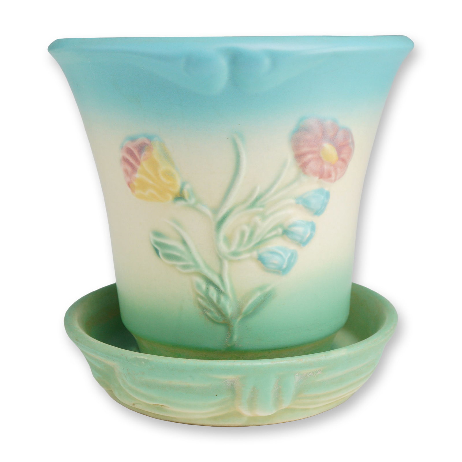 Hull Art Pottery Bowknot Pattern Planter: Produced by the Hull Pottery Company, this matte-glazed earthenware planter showcases the elegant Bowknot pattern, a favorite among collectors since its debut in the late 1940s. The piece features a g