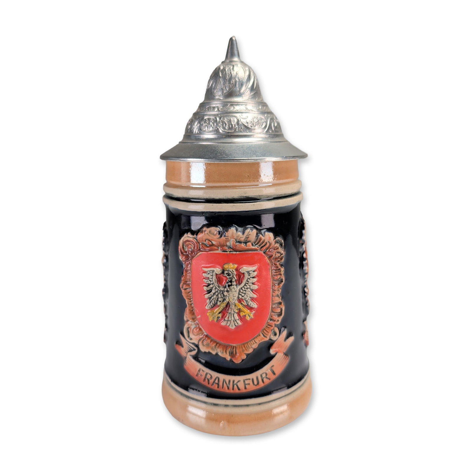 West German Heraldic Lidded Beer Stein: A West German salt-glazed stoneware lidded beer stein. The dark blue-black body features three high-relief heraldic crests representing the cities of Frankfurt, Wiesbaden, and Heidelberg, each framed 
