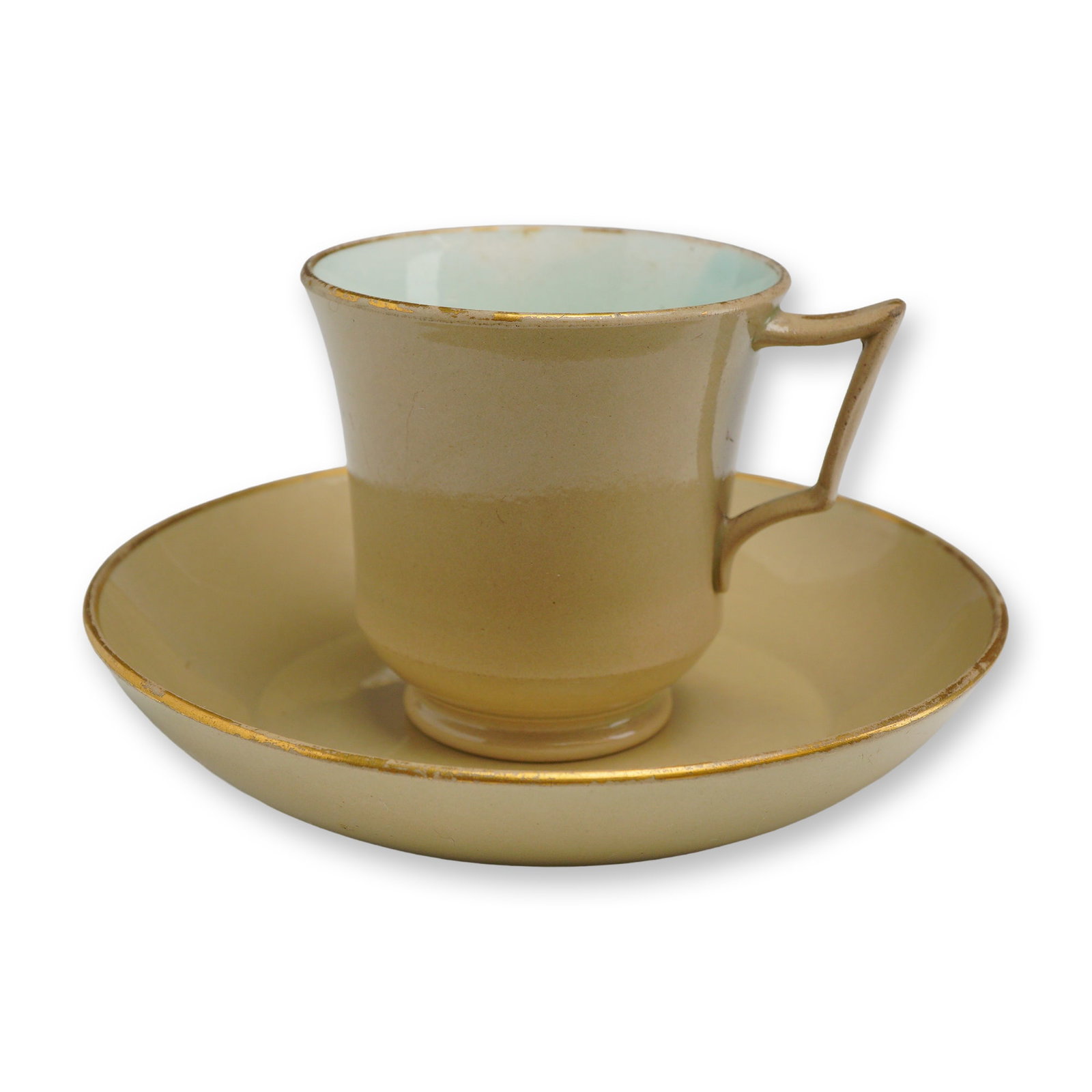 Wedgwood Drabware Cup and Saucer: A Wedgwood cup and saucer set crafted from fine drabware earthenware, dating to the early 19th century. The set features a tan or biscuit-colored exterior glaze and a contrasting pale turquoise or