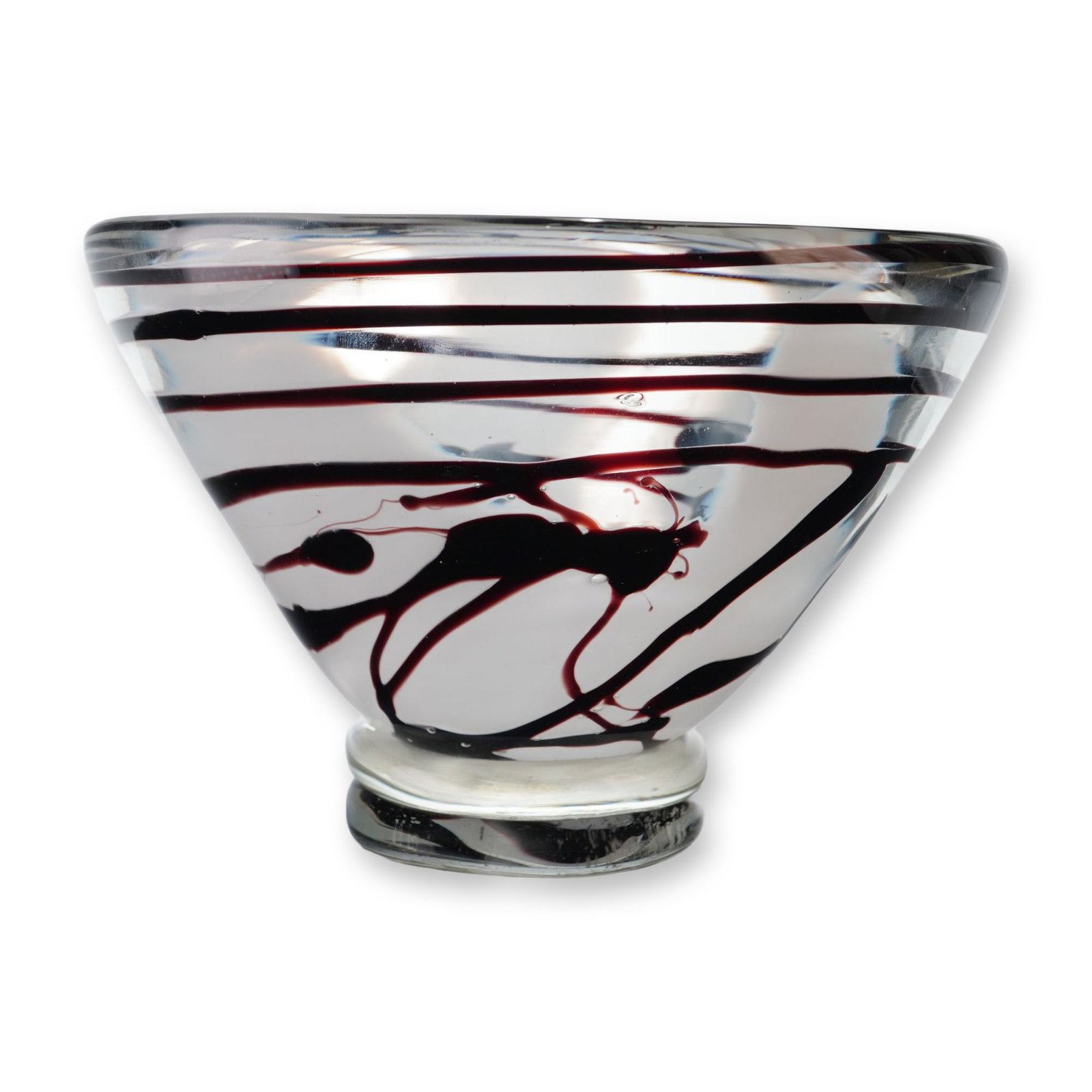 Gorgeous Designs China Decorative Art Glass Bowl: The vessel features a tapered conical form terminating in a thick, rounded clear foot. The piece is decorated with internal applications of chocolate colored swirl decoration throughout. This