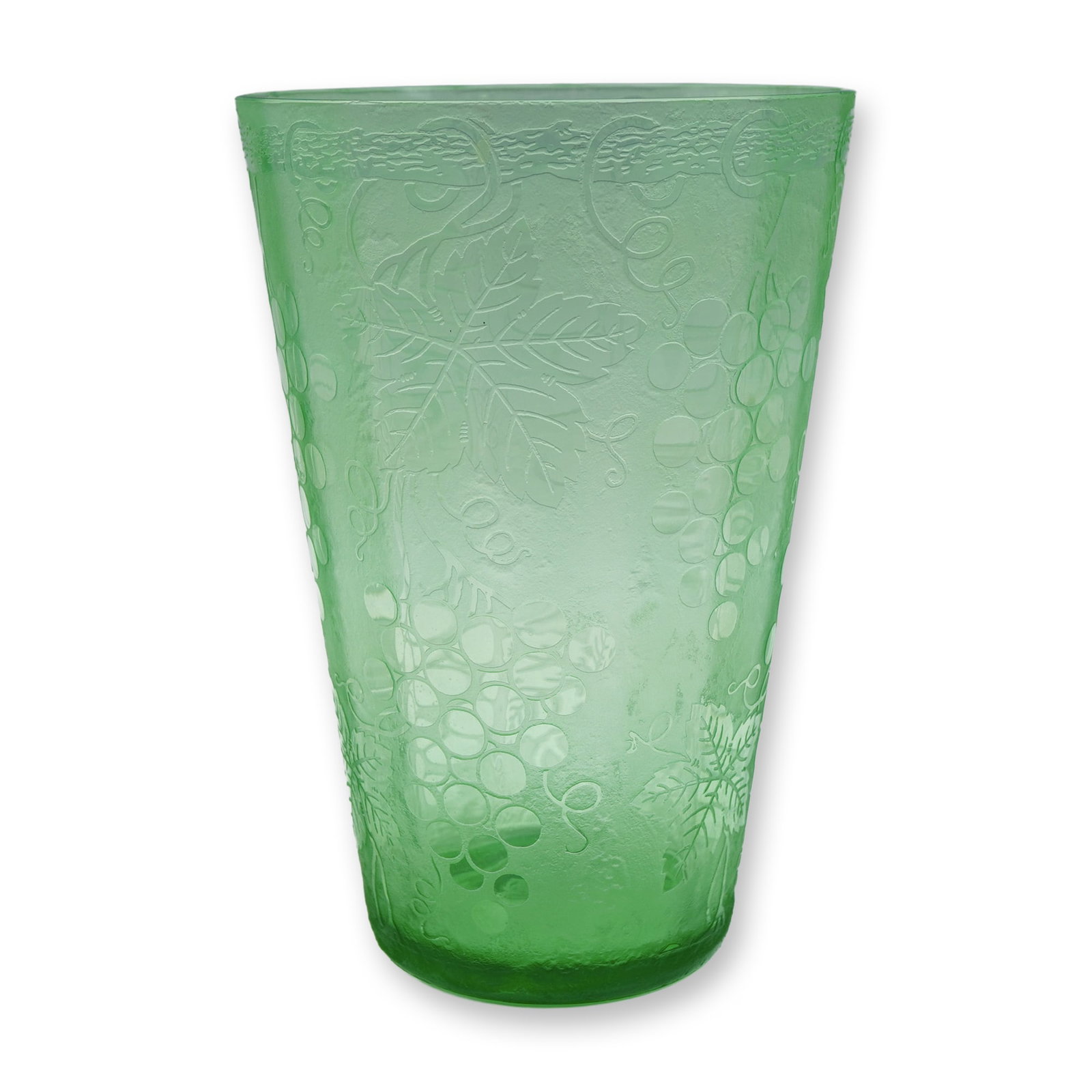 Green Pressed Glass Tumbler with Grape and Vine Decoration: A vibrant green pressed glass tumbler decorated in relief with a pattern of grape clusters, tendrils, and large vine leaves. The matte-textured ground contrasts subtly with the glossy raised design, g
